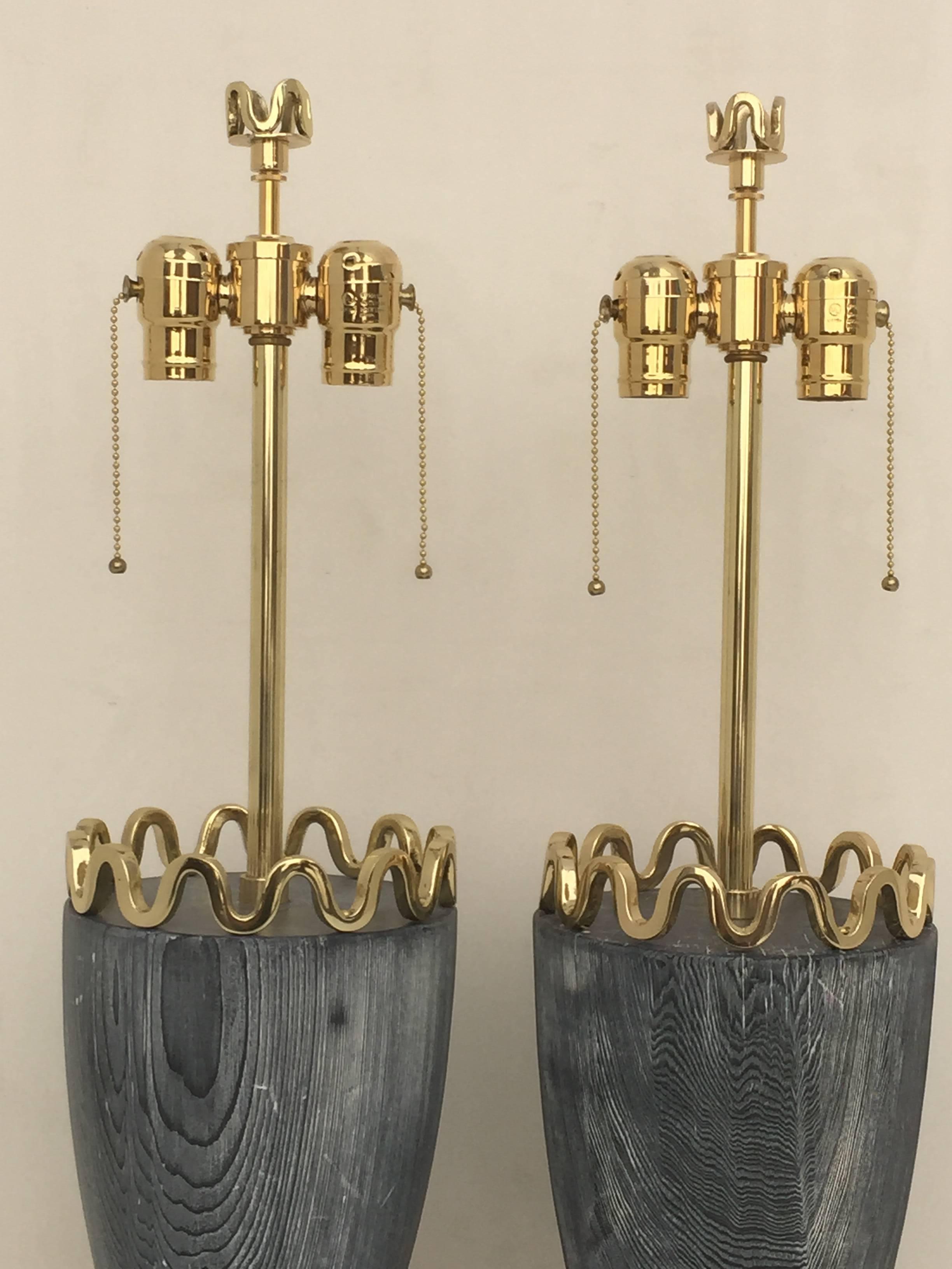 James Mont cerused redwood and polished brass lamps.