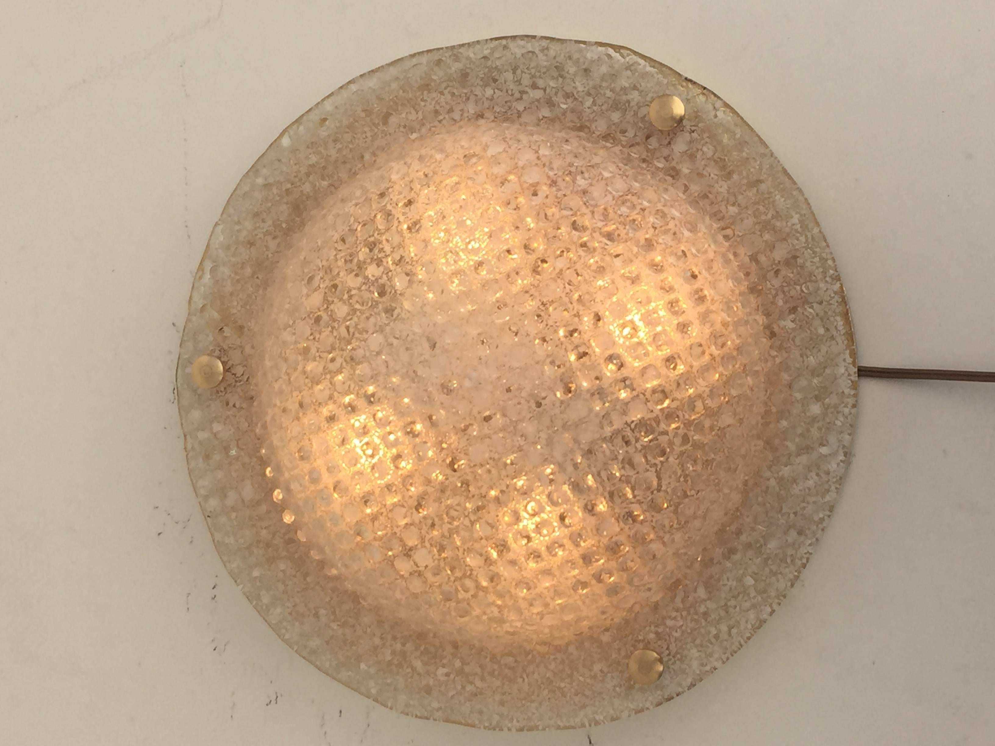 Textured bubble glass flush mount attributed to Hillebrand lighting. Wired to USA and requires 3 up to 40watt bulbs. Needs to be hardwired to the wall or ceiling by licenced electrician.