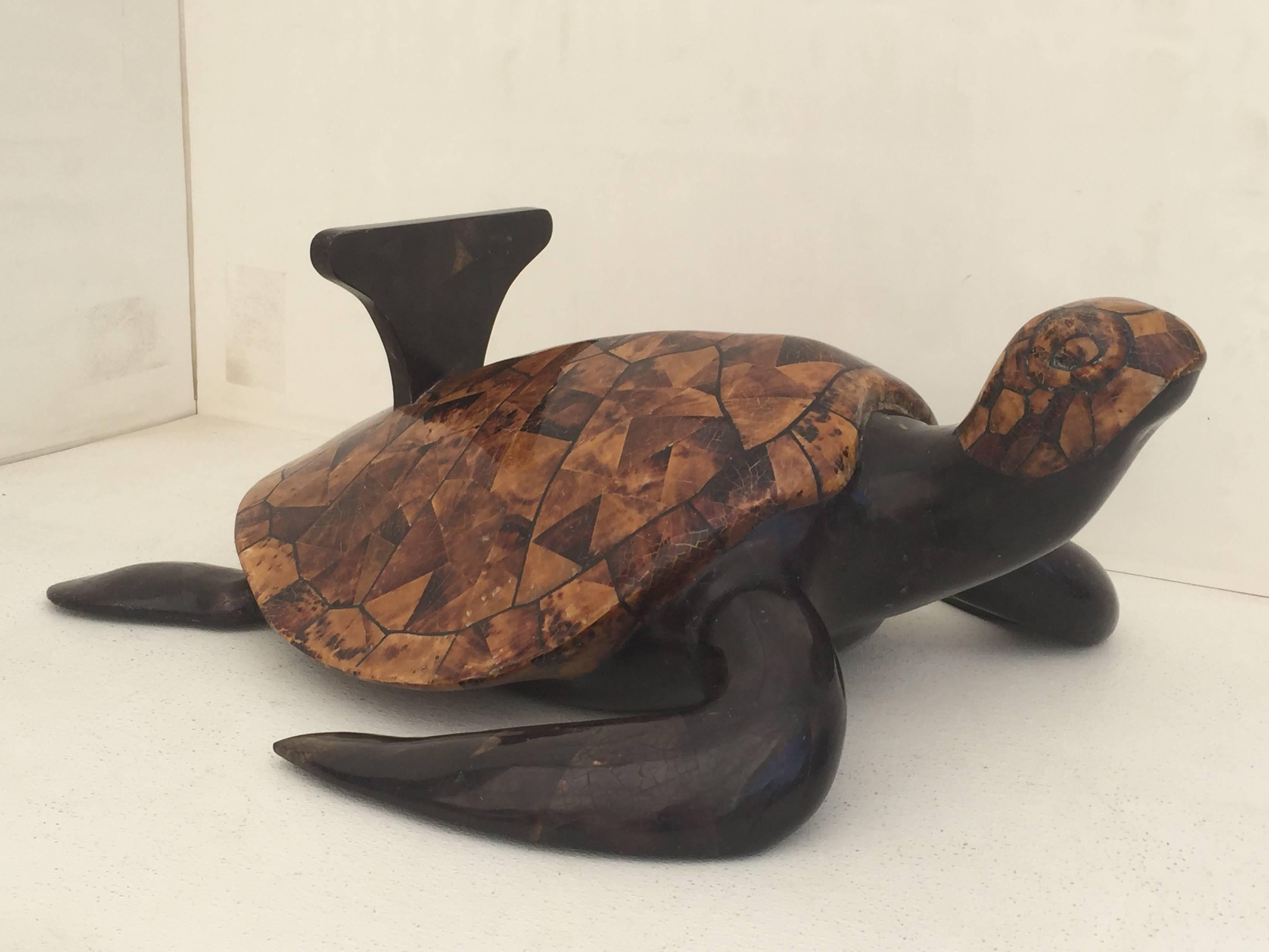 Tessellated coconut shell turtle coffee table attributed to Maitland-Smith.
Egg shaped glass top is 45.5