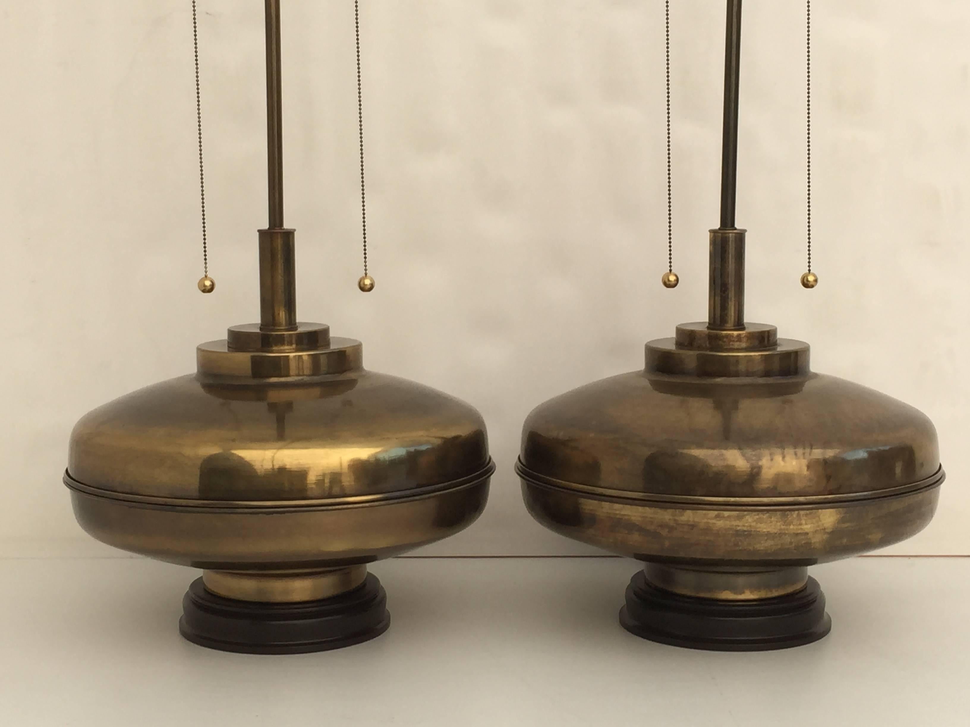 Pair of giant lamps in antiqued bronze finish. One lamp has a age spot on the back side.