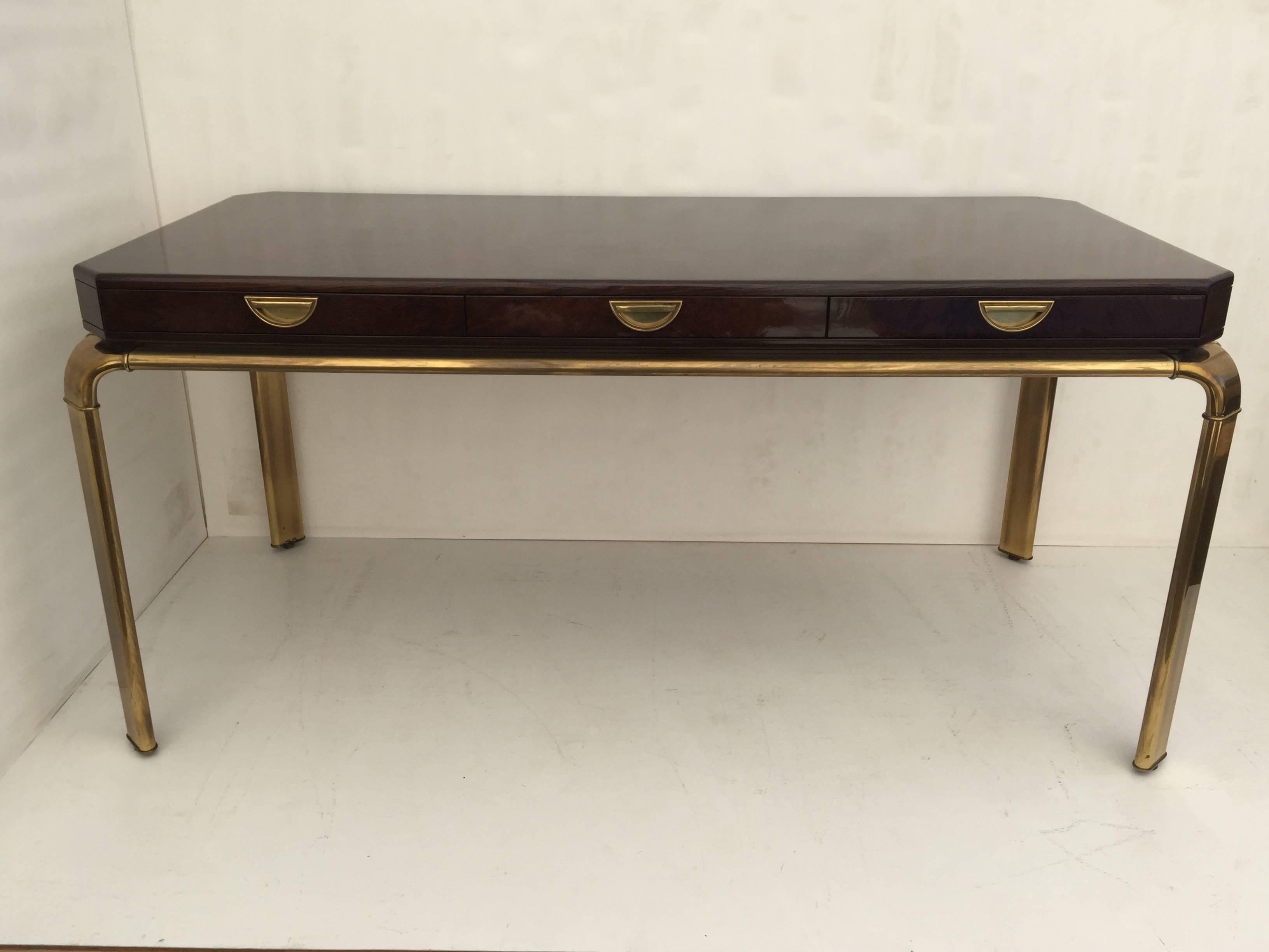 High gloss polyurethane burl wood and patinated brass desk by John Widdicomb.
 