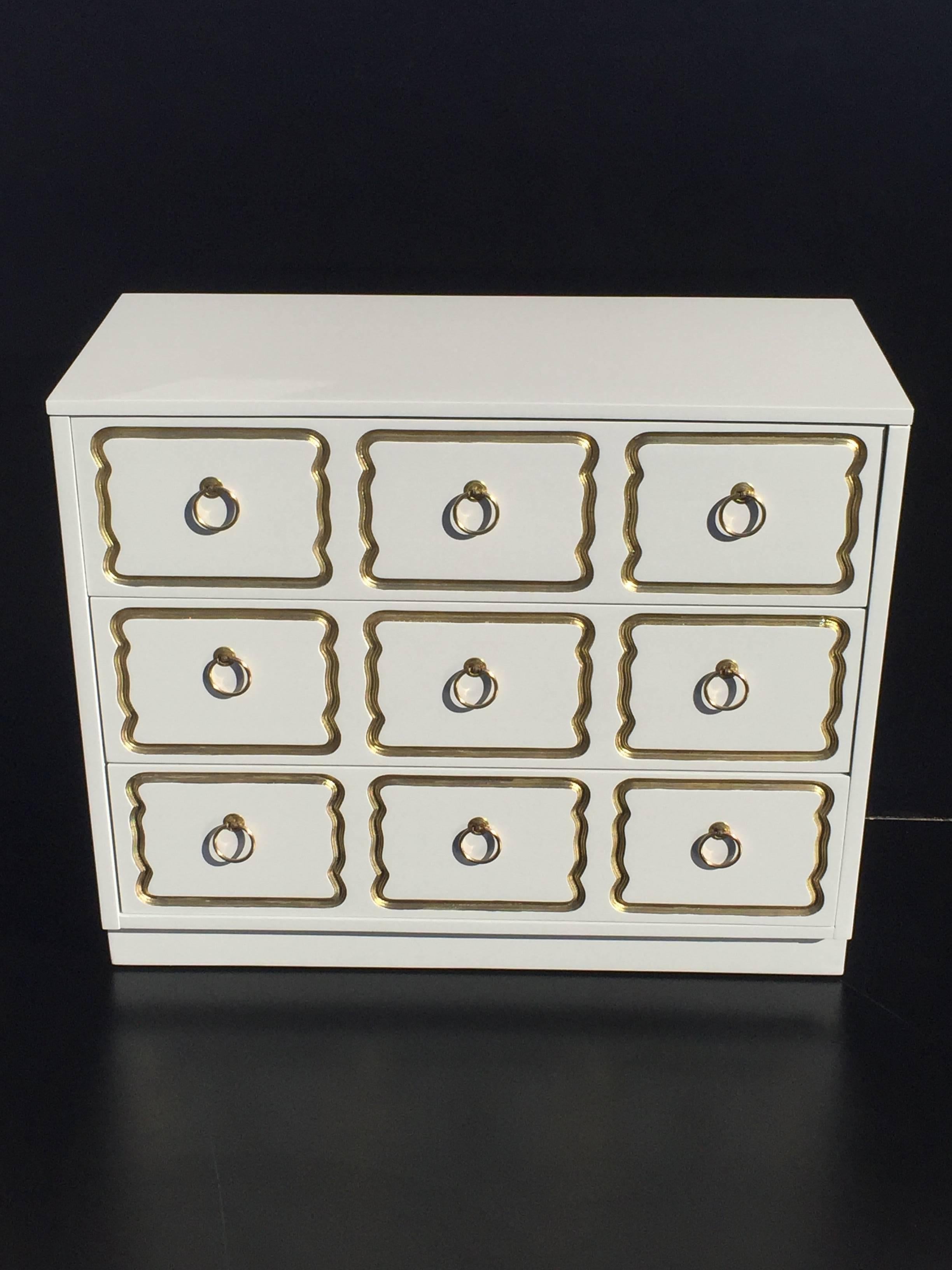 Chest of drawers in cream lacquer and gold in the style of Dorothy Draper.