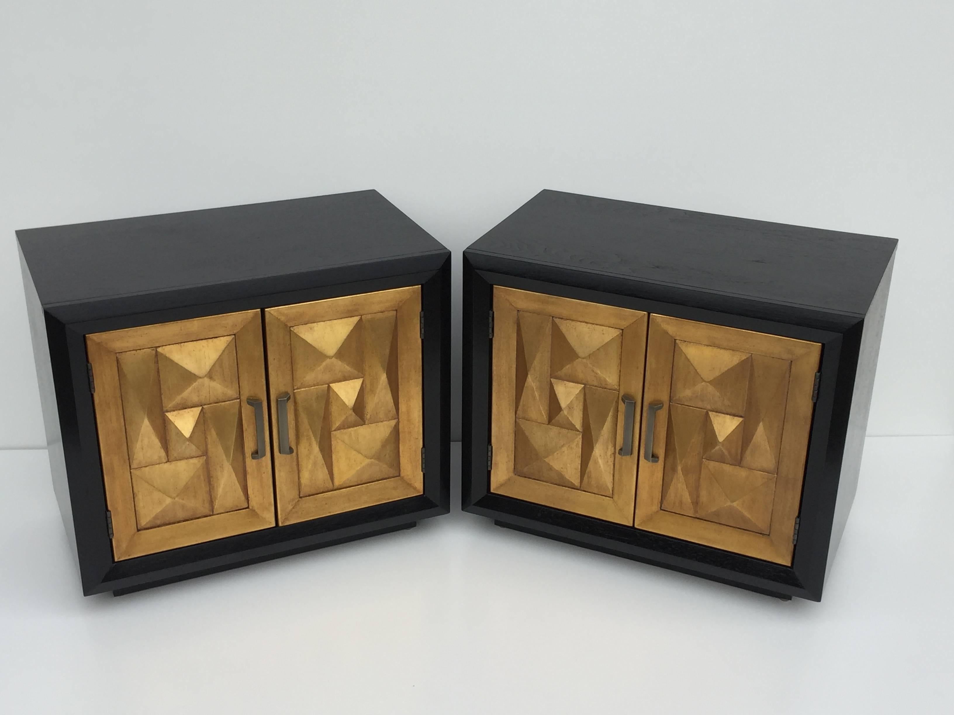 Pair of sculptural diamond front gold leafed and ebonized walnut nightstands.