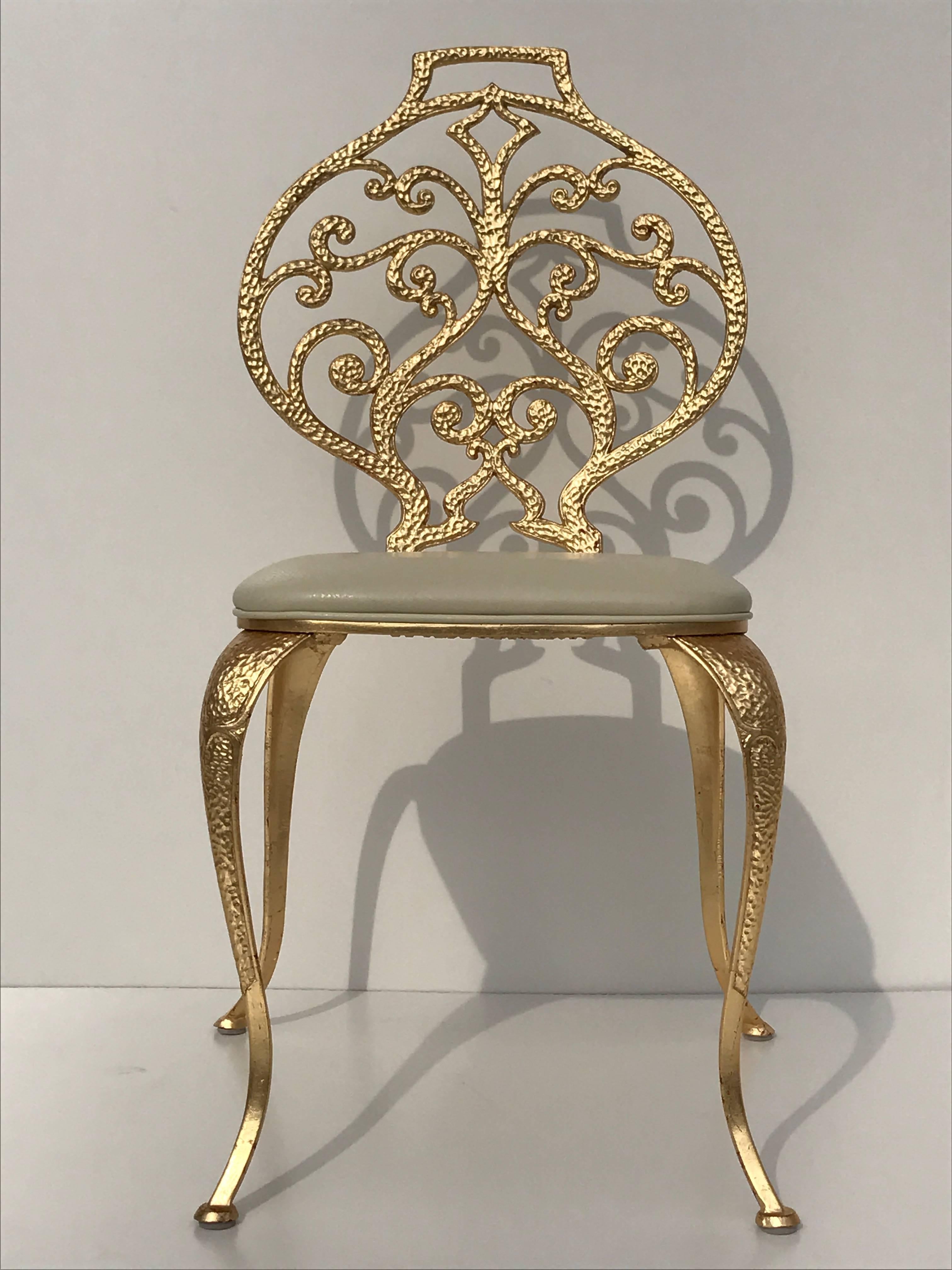 Gold leafed vanity or dining chairs by Thinline Mfg made of solid aluminum.
Can be used indoors or outdoors. 
Also can be used with or without seat. Priced individually. Two available.
