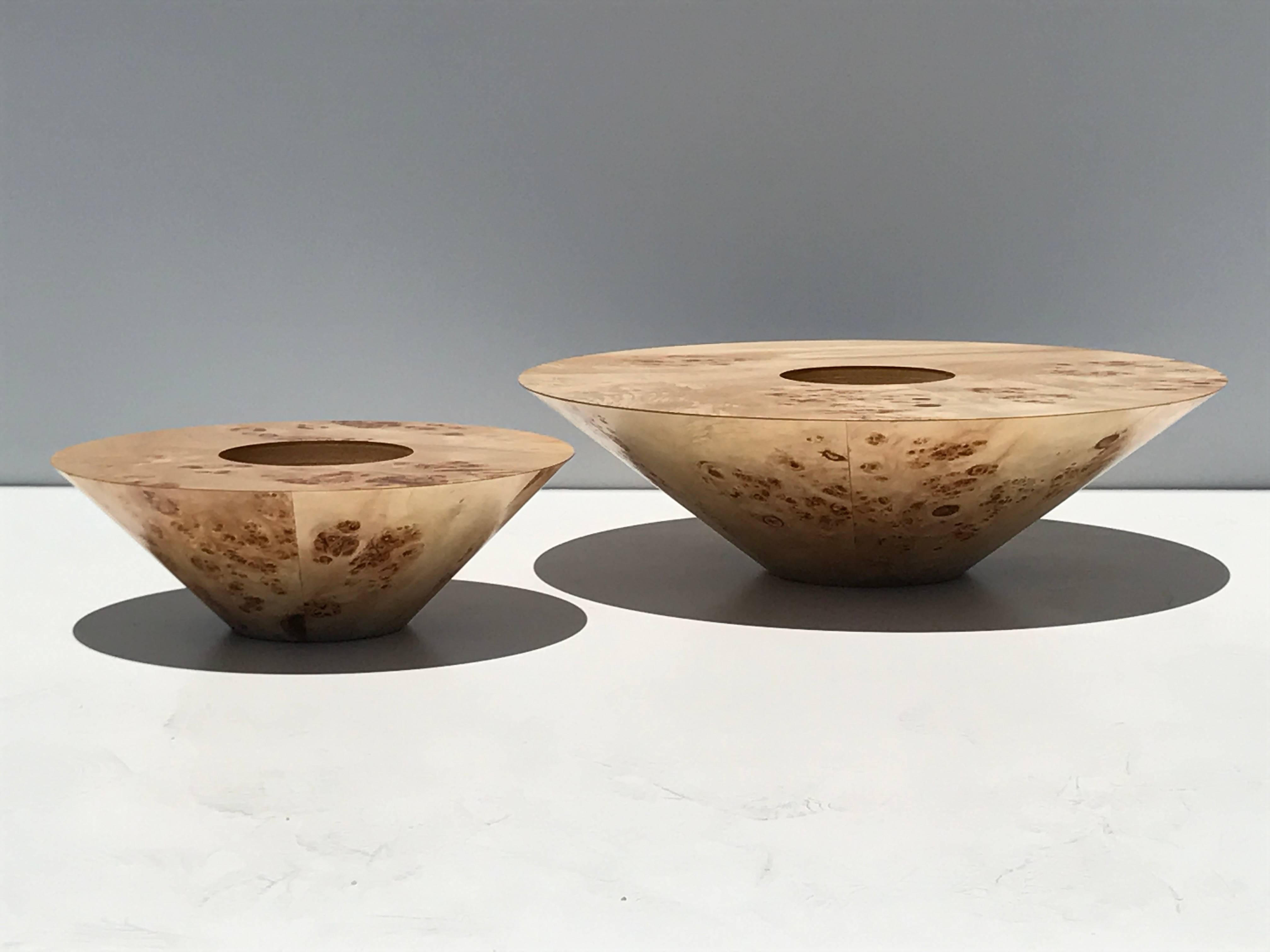 Set of two burl wood candleholders. 
Measures: Large is 18 