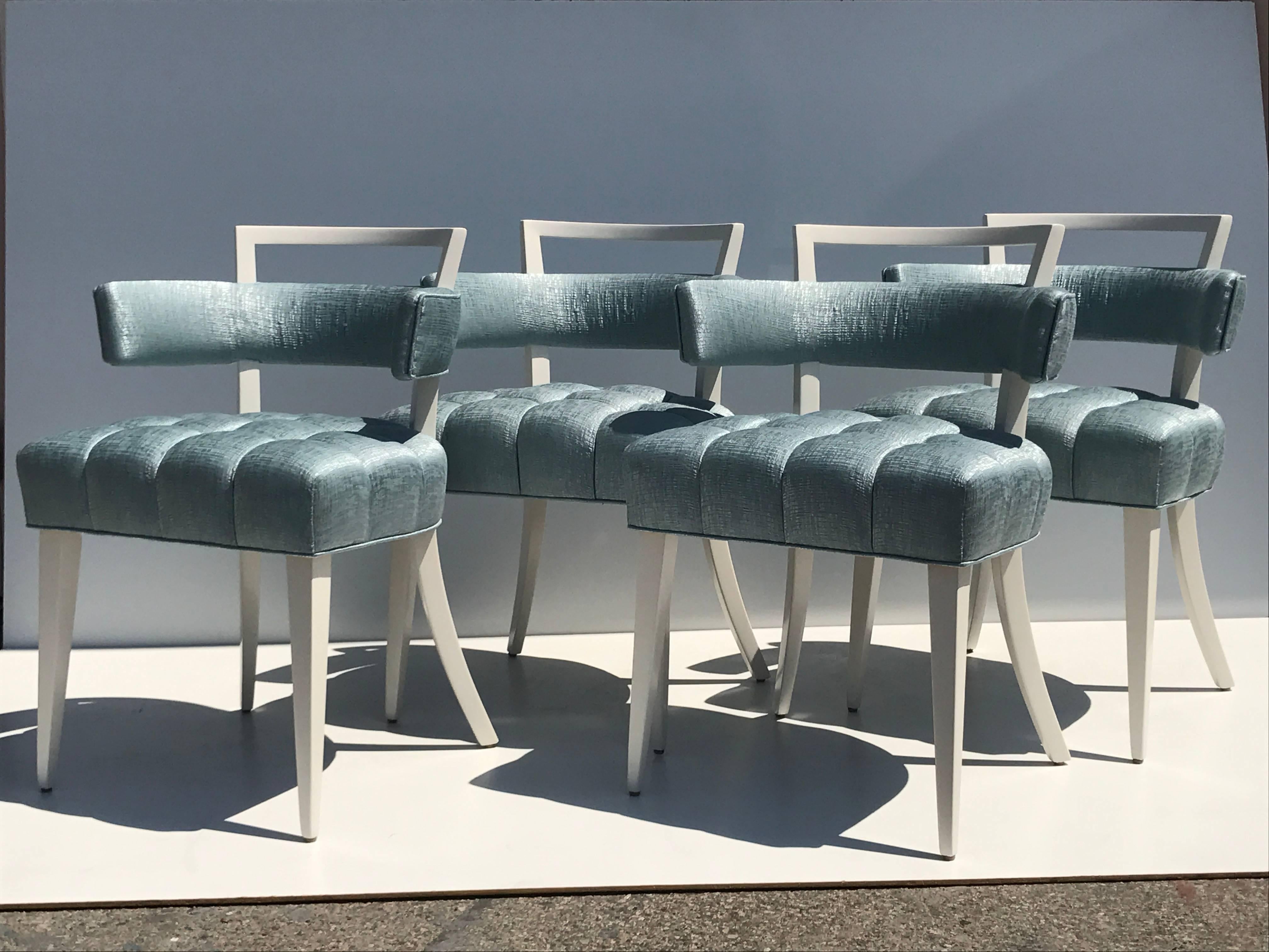 Set of four Billy Haines attributed biscuit tufted side or dining chairs. Elegantly designed and super comfortable for resting arms. 
Two pairs available. Price is per pair. Completely restored and upholstered in silver metallic textured fabric.