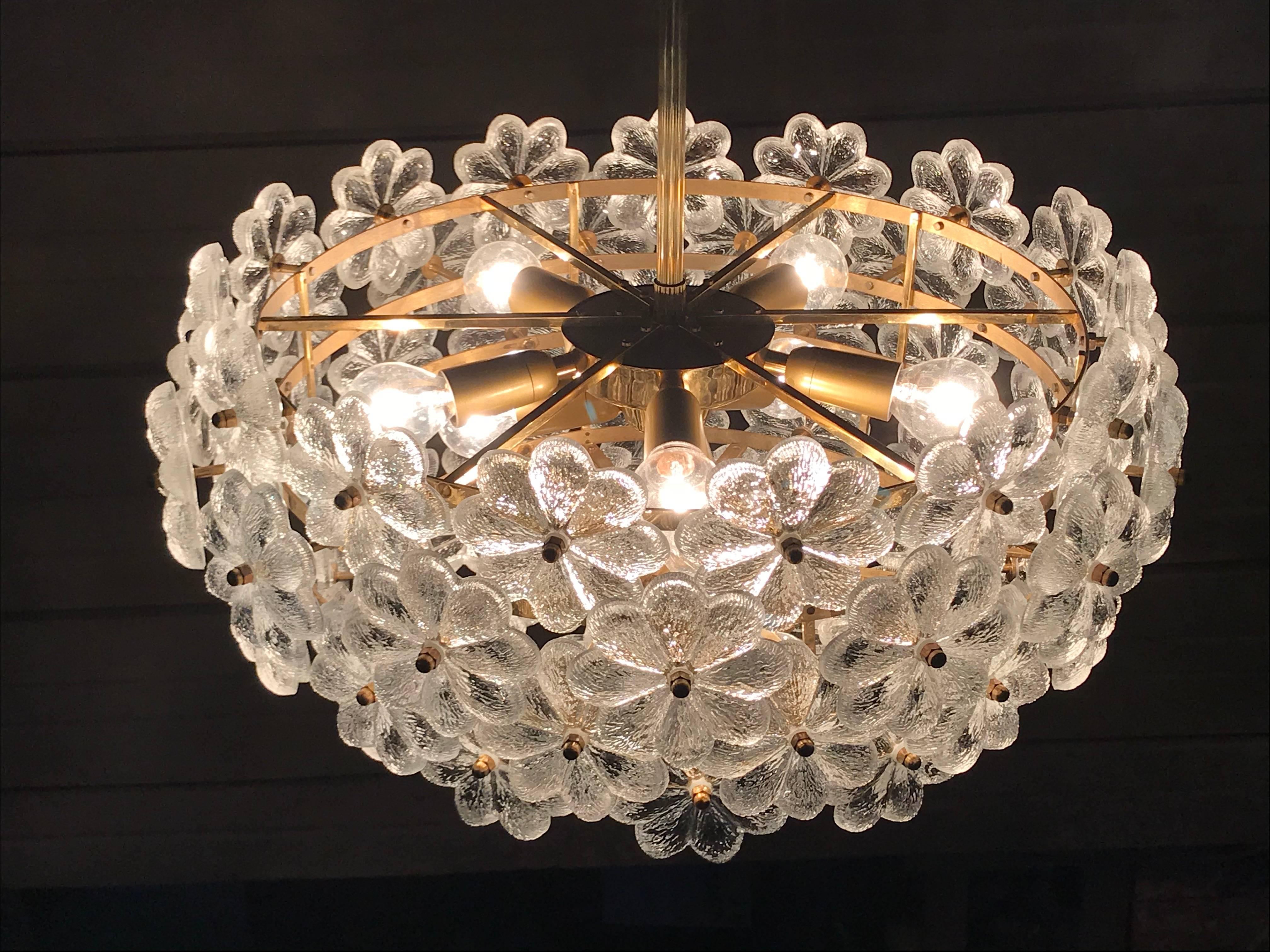 Ernst Palme floral glass sputnik chandelier.
It holds eight up to 40watt E14 light bulbs (included)
Diameter is 21 inches by 10 inches high, total height with the rod is 32