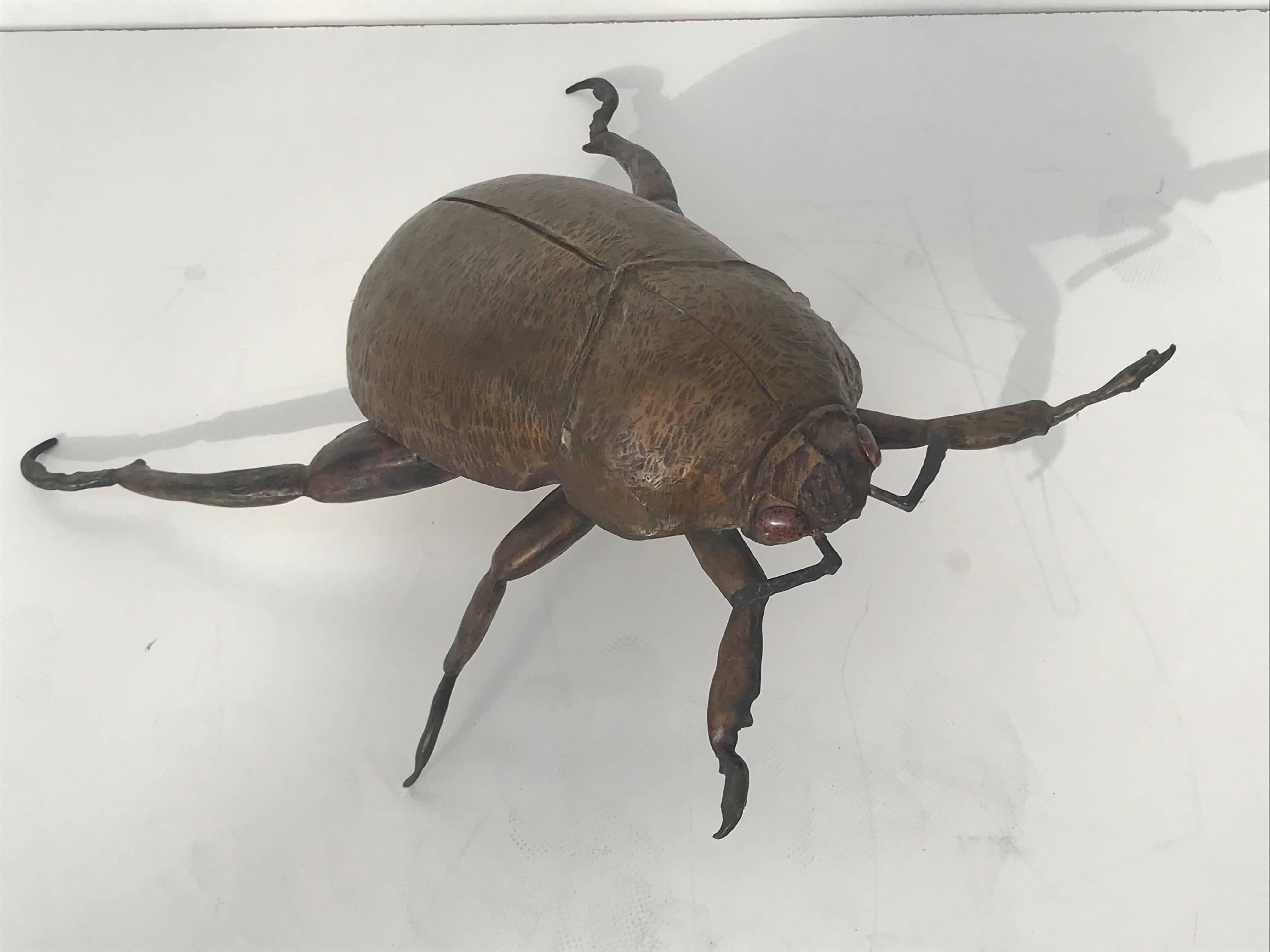 Giant garding beetle sculpture in bronze.