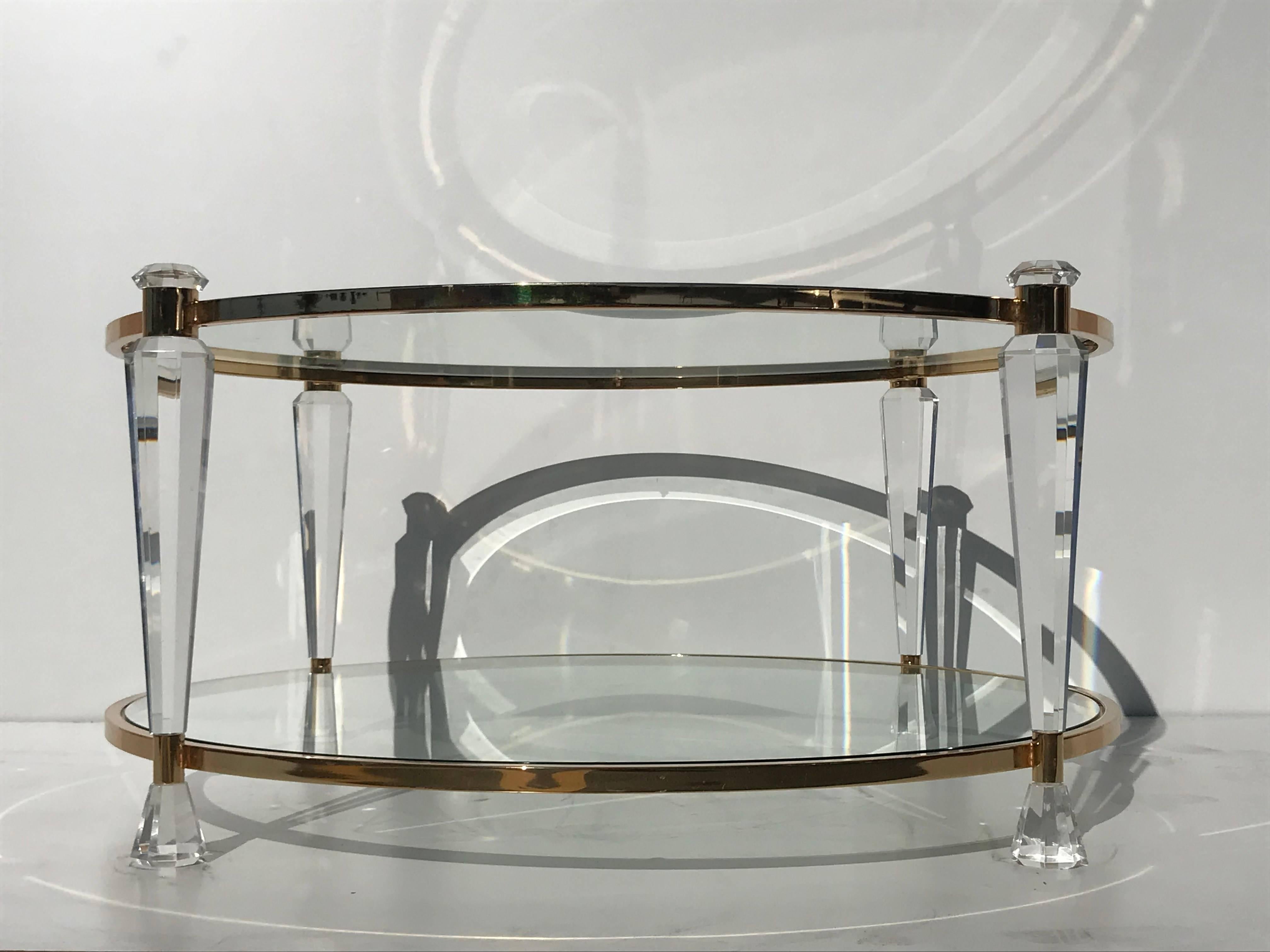 Two-tier round Lucite and glass coffee table in the style of Charles Hollis Jones.