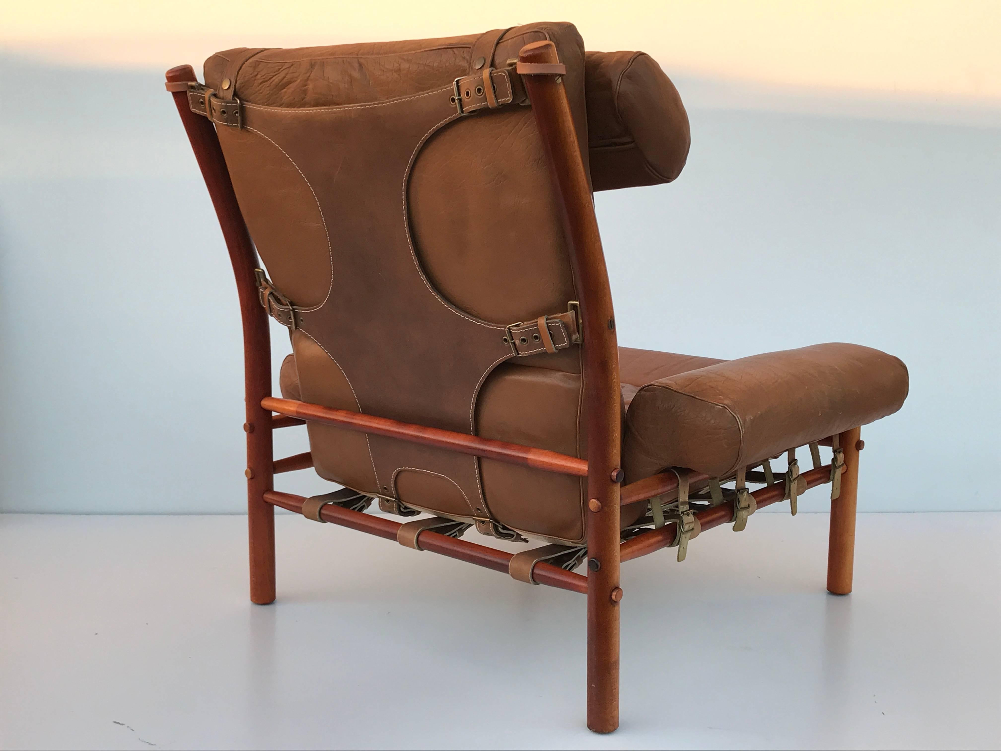 Arne Norell Inca lounge chair and footrest in patinated leather and European beechwood
Measures: Chair is 36
