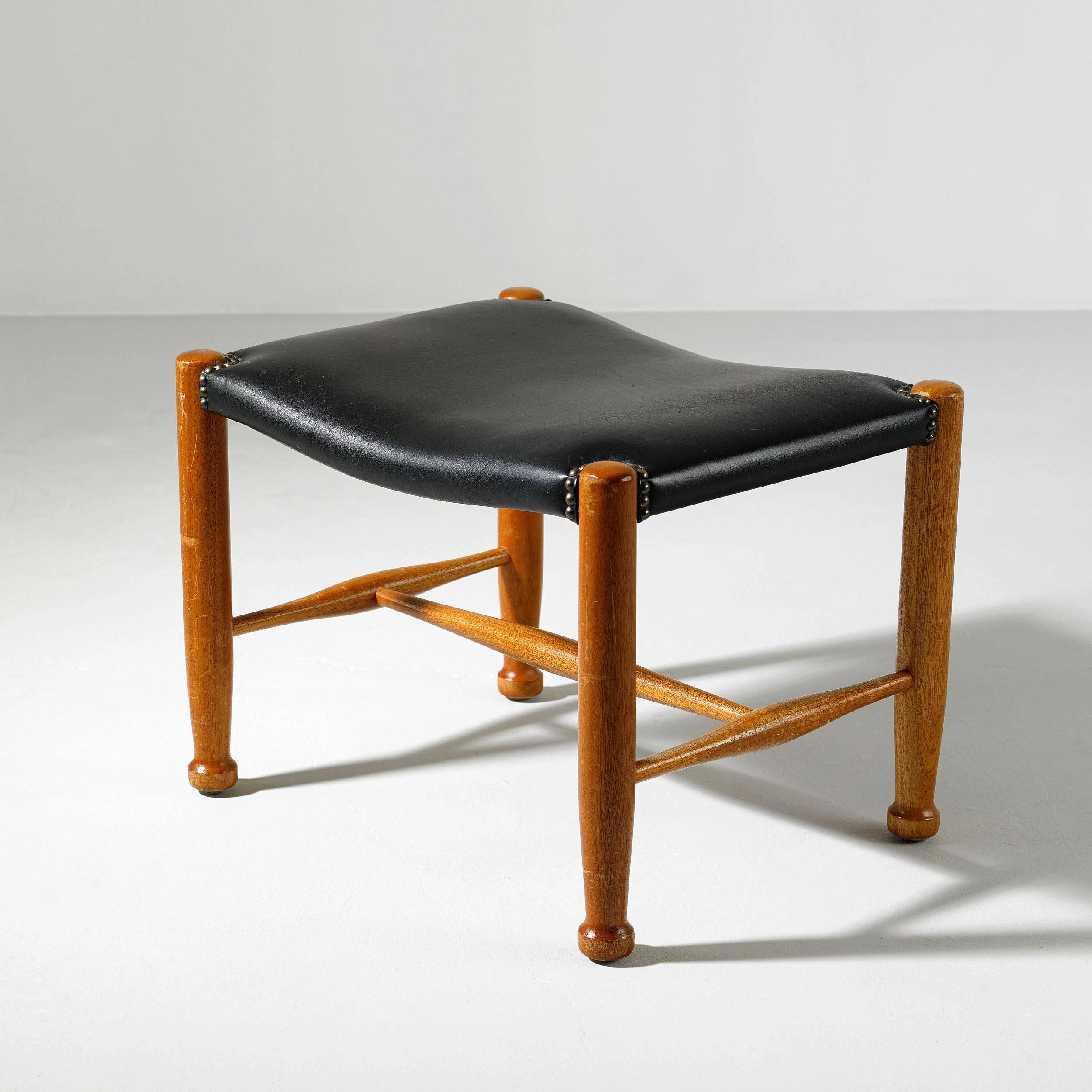 Josef Frank, a stool for Svenskt Tenn, modell number 686, designed in 1936, mahogany and black leather.