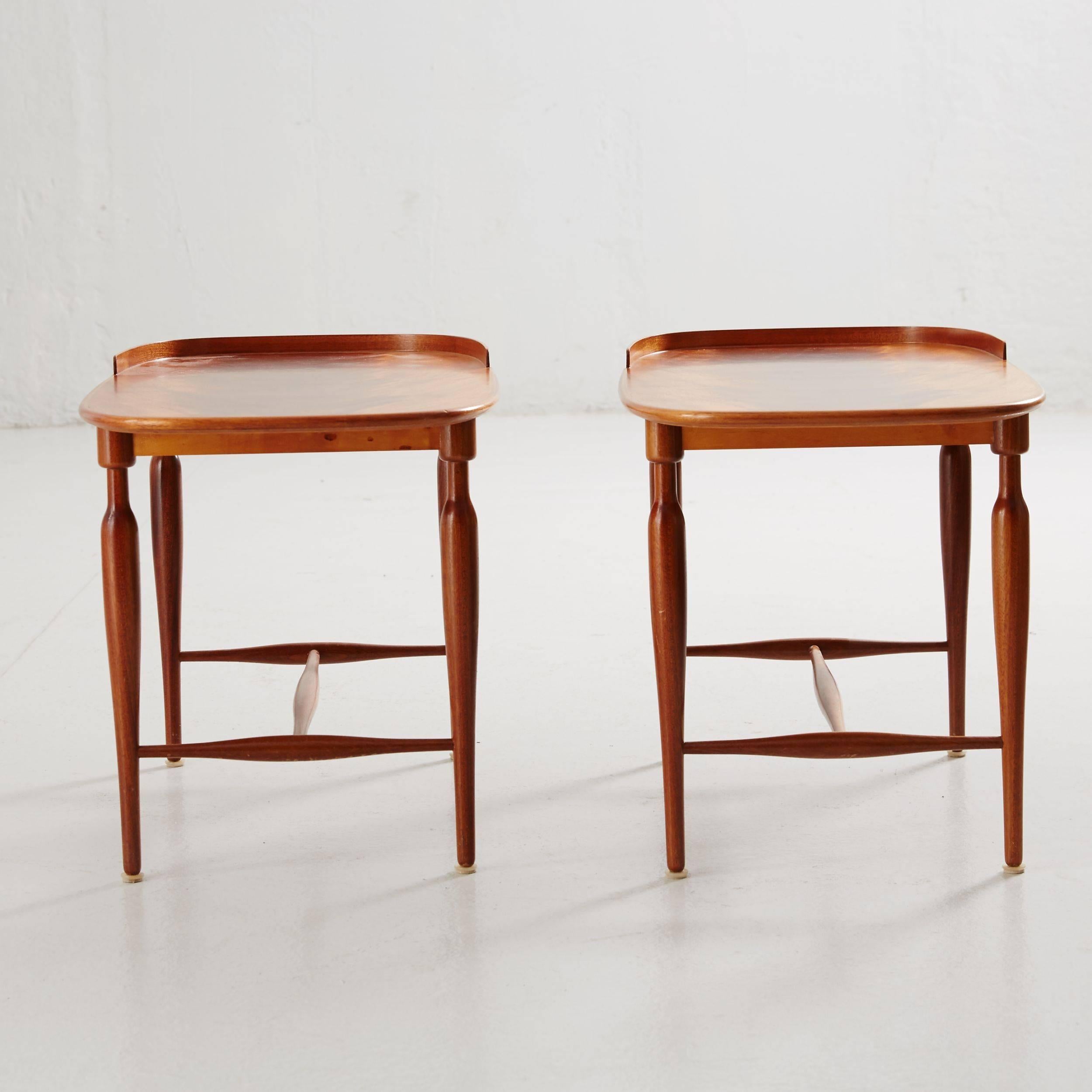 These unusual mahogany tables with rounded corners and high edges on one side were designed, circa 1938. Turned out legs with stylized paw feet and the H-shaped base were typical of Josef Frank’s designs with their grace and elegance.
Measures: 41