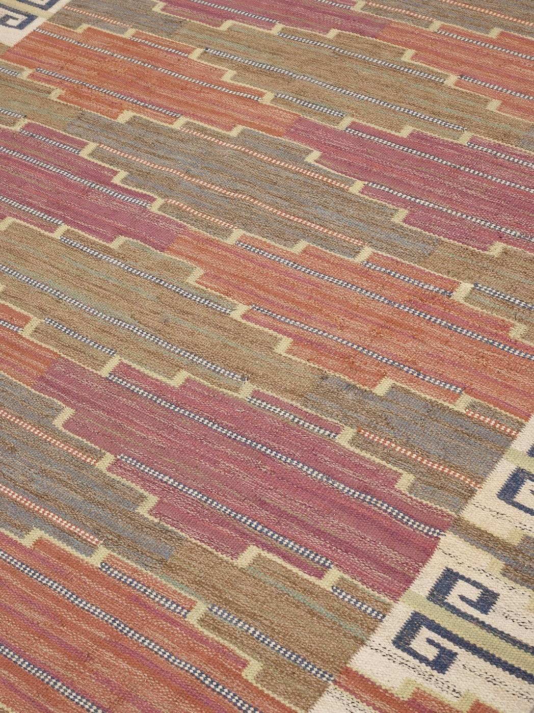 This early Märta Måås-Fjetterström carpet was designed in 1931 and woven before 1942. Some minor repairs and later fringes. Measures: 306 x 204 cm.