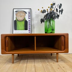 Dyrlund low teak sideboard with retractable doors, Denmark, 19**s
