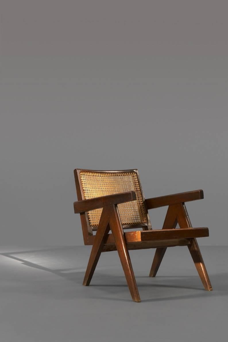 Pierre Jeanneret (1896-1967),

Easy armchair,
circa 1955.

Indian teak structure, canned seat and backrest, compass-shaped legs.
Dimensions: H. 26.8 x L. 20.5 x D. 23.62 in.

Provenance: Special commission for the Penjab university (P.U),