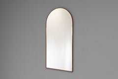Miroir à cadre voûté