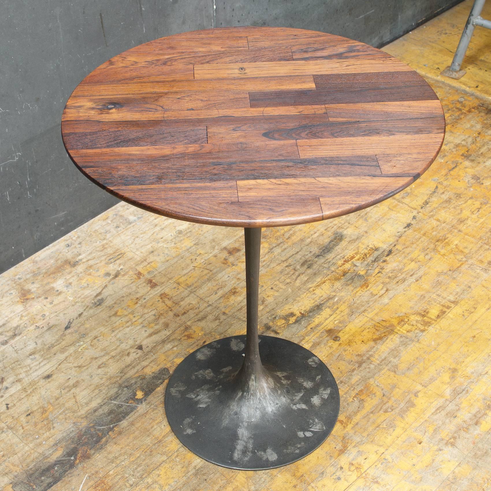 Very Unique Tulip Table, Odd Configuration; with a revealed cast iron base, showing the chasing spots, and staved rosewood tabletop. Extremely heavy.