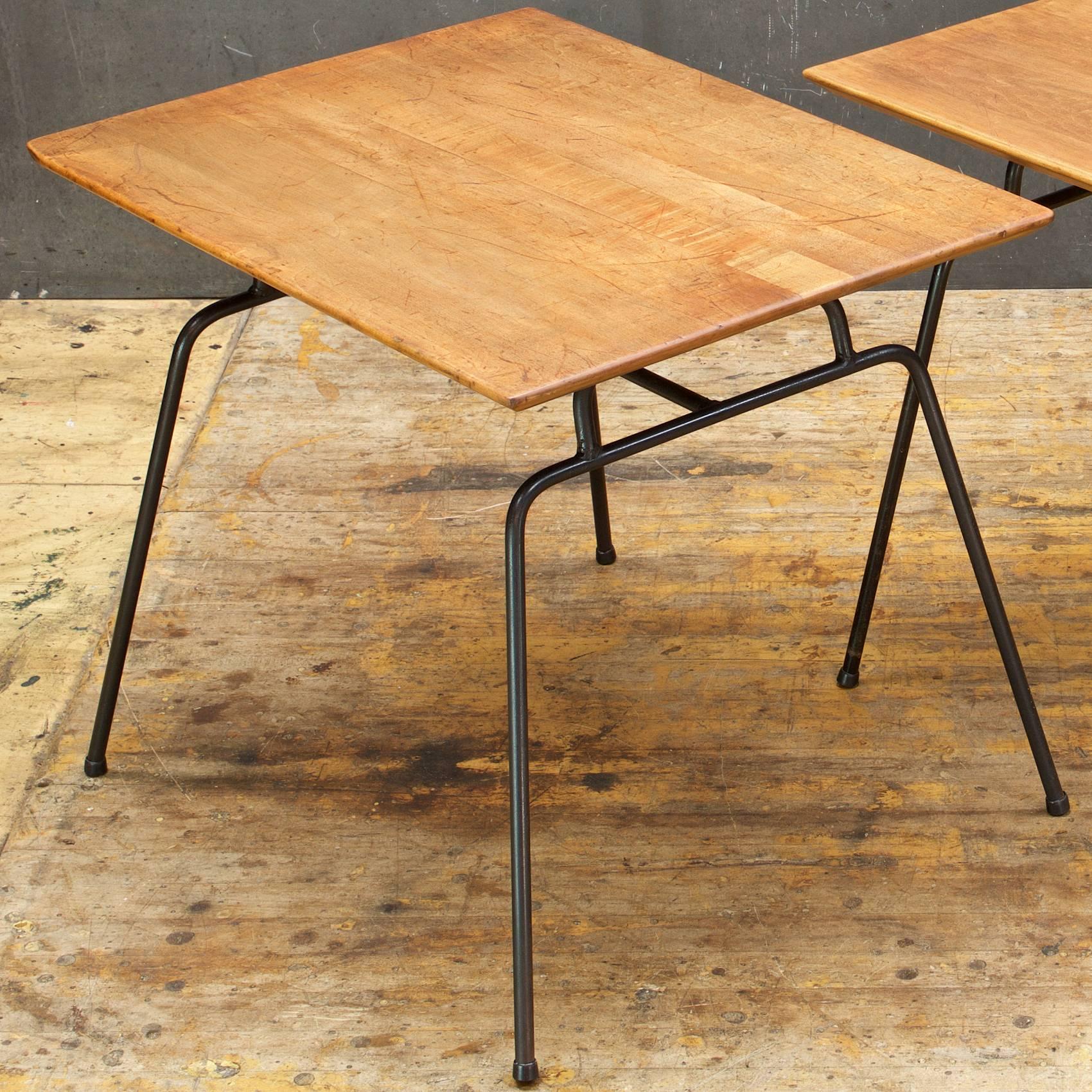 1950s rare early Paul McCobb iron rod sofa end tables. Pair of solid staved Canadian Birch surfaces on 1/2 inch iron rod bases and plastic feet on each leg tip.  One wooden Tabletop is very worn. Early Discontinued Planner Group variation.