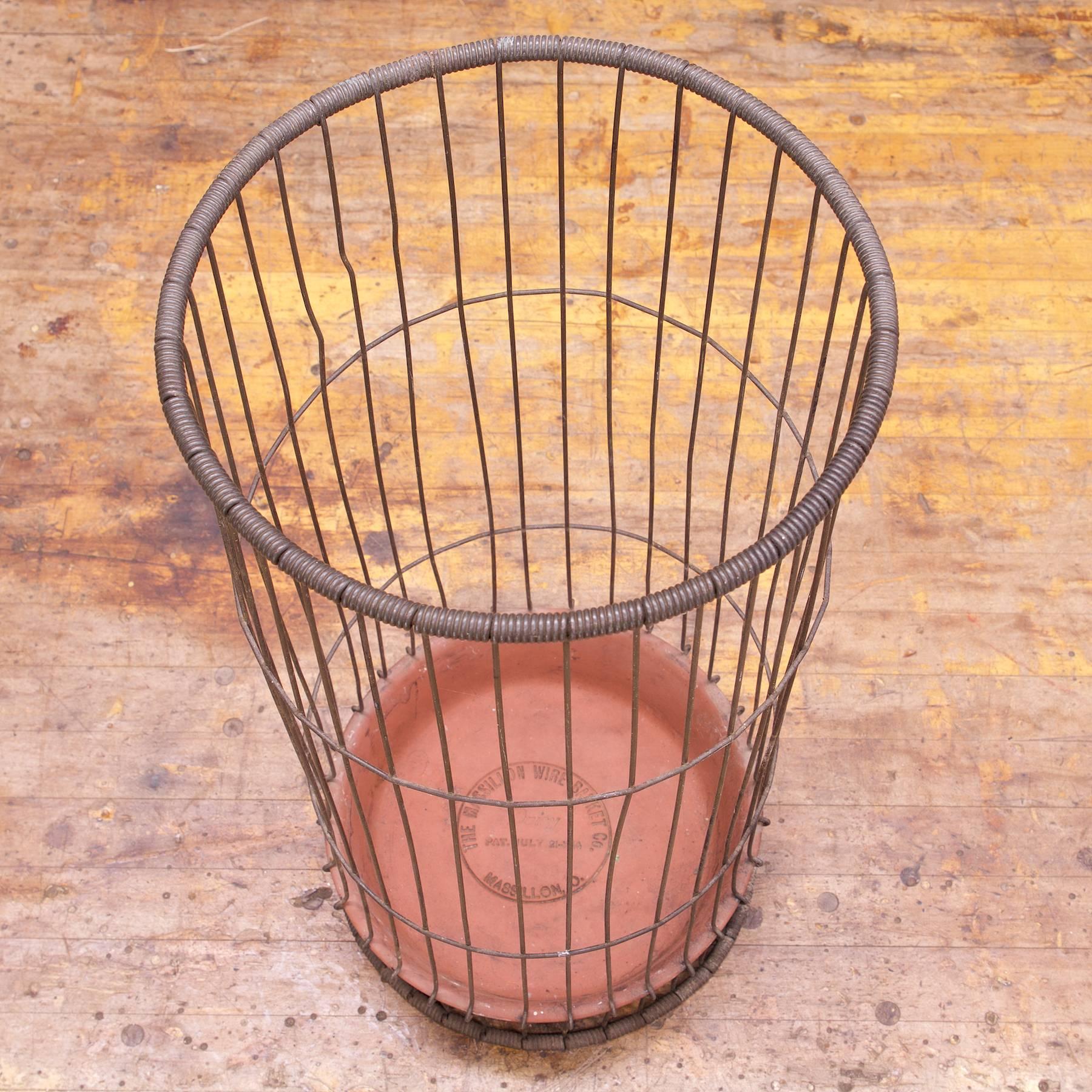 Rare tall wire basket with clay/pottery dish, marked with manufacturers markings and patent date/nos.