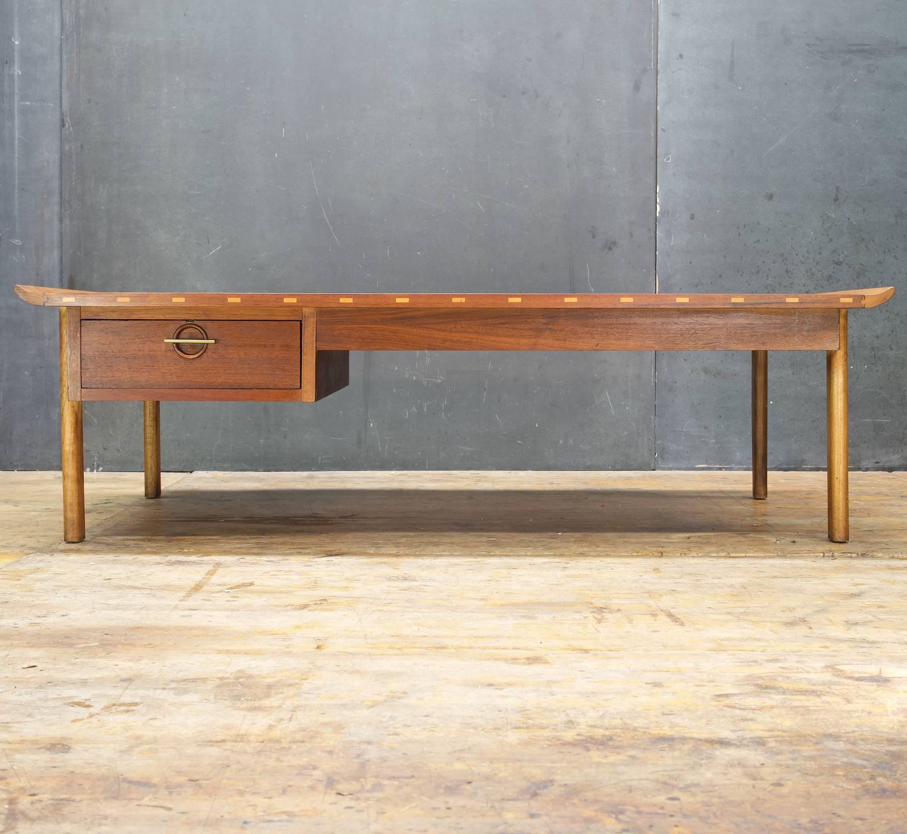 Large light/dark Mid-Century Modern coffee table with single drawer.