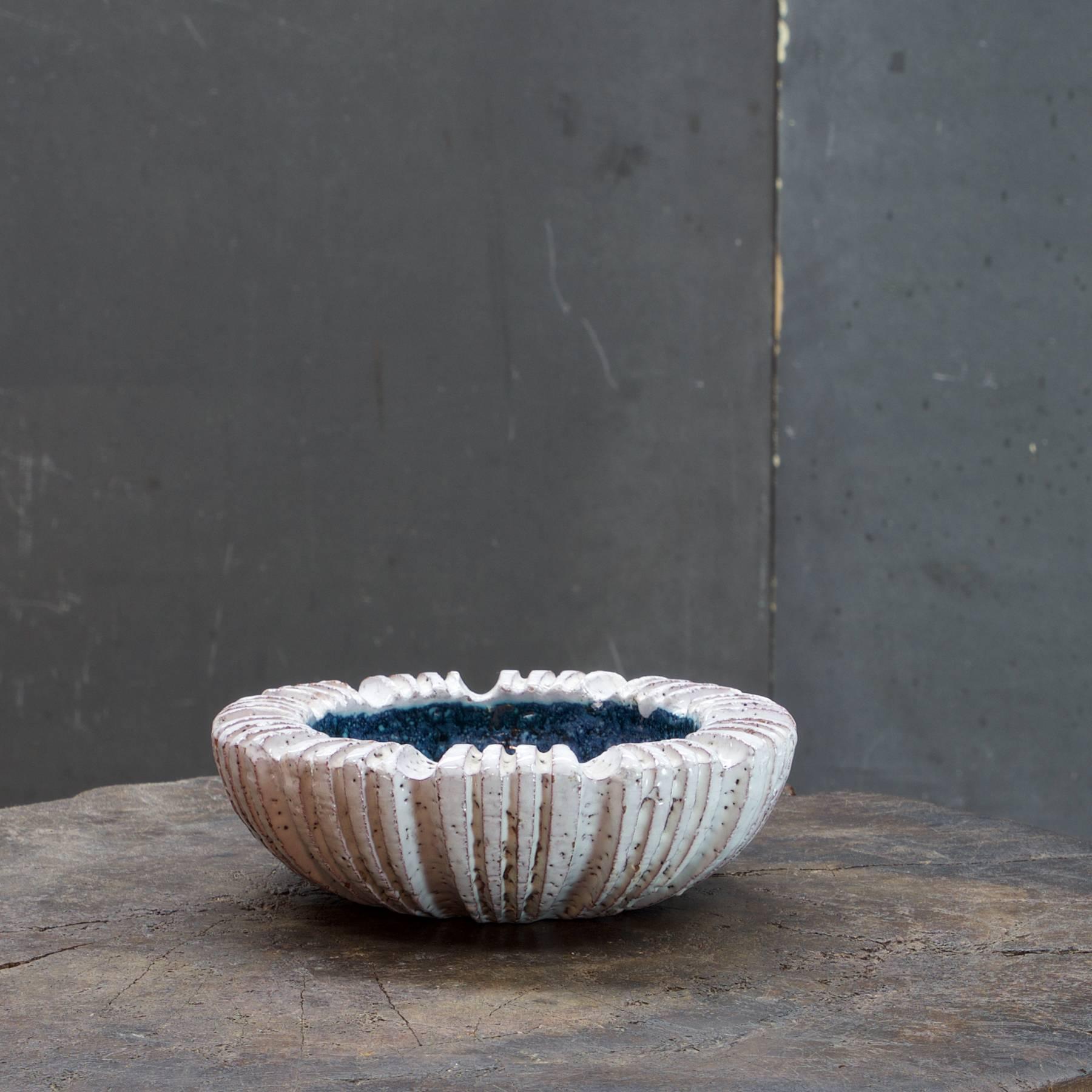 Hand built stoneware bowl or ashtray with white and blue speckled and dappled glazes, signed and dated, 1950.