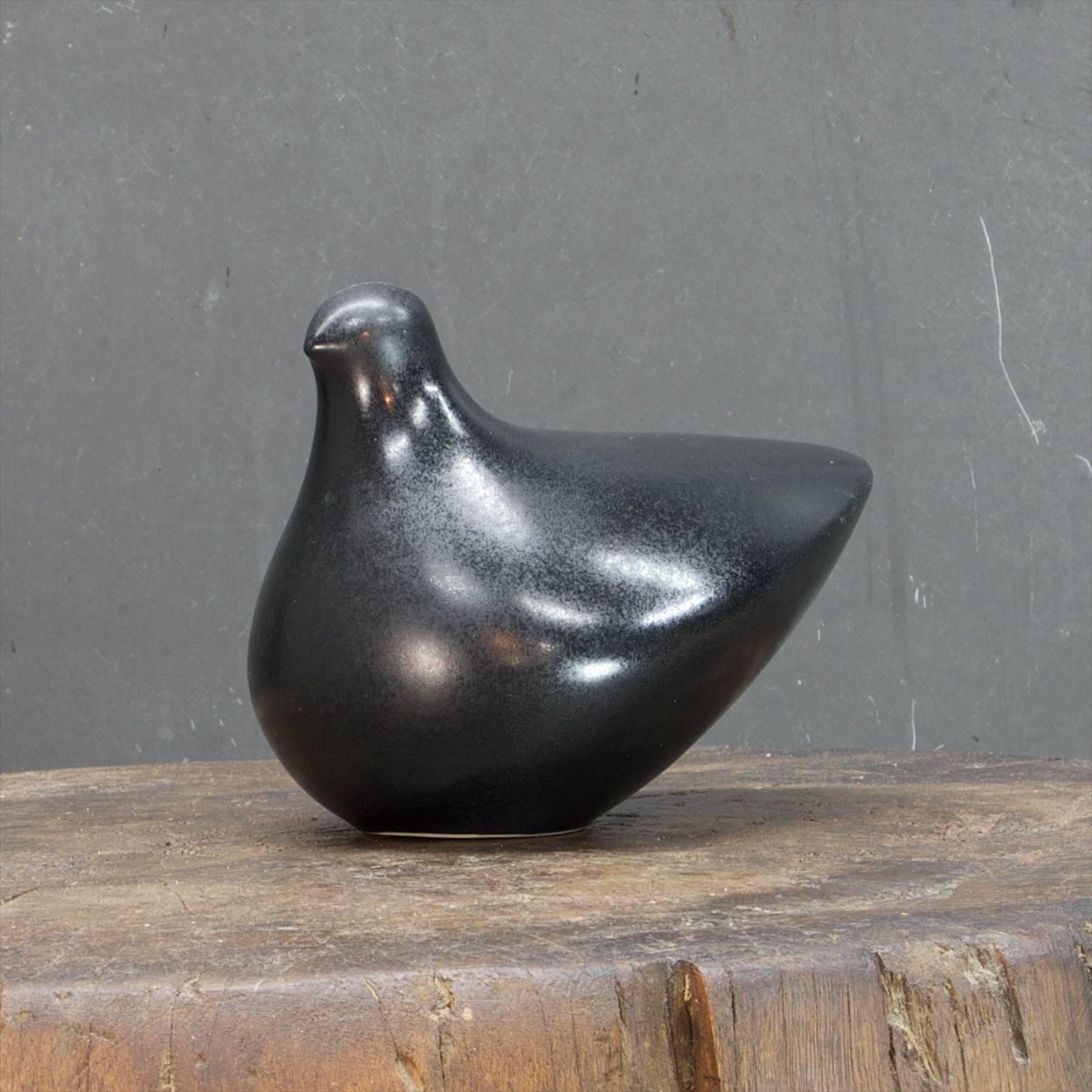 A glazed ceramic dove form sculpture by Quebec artists Guy Simoneau and Christiane Paquin. 