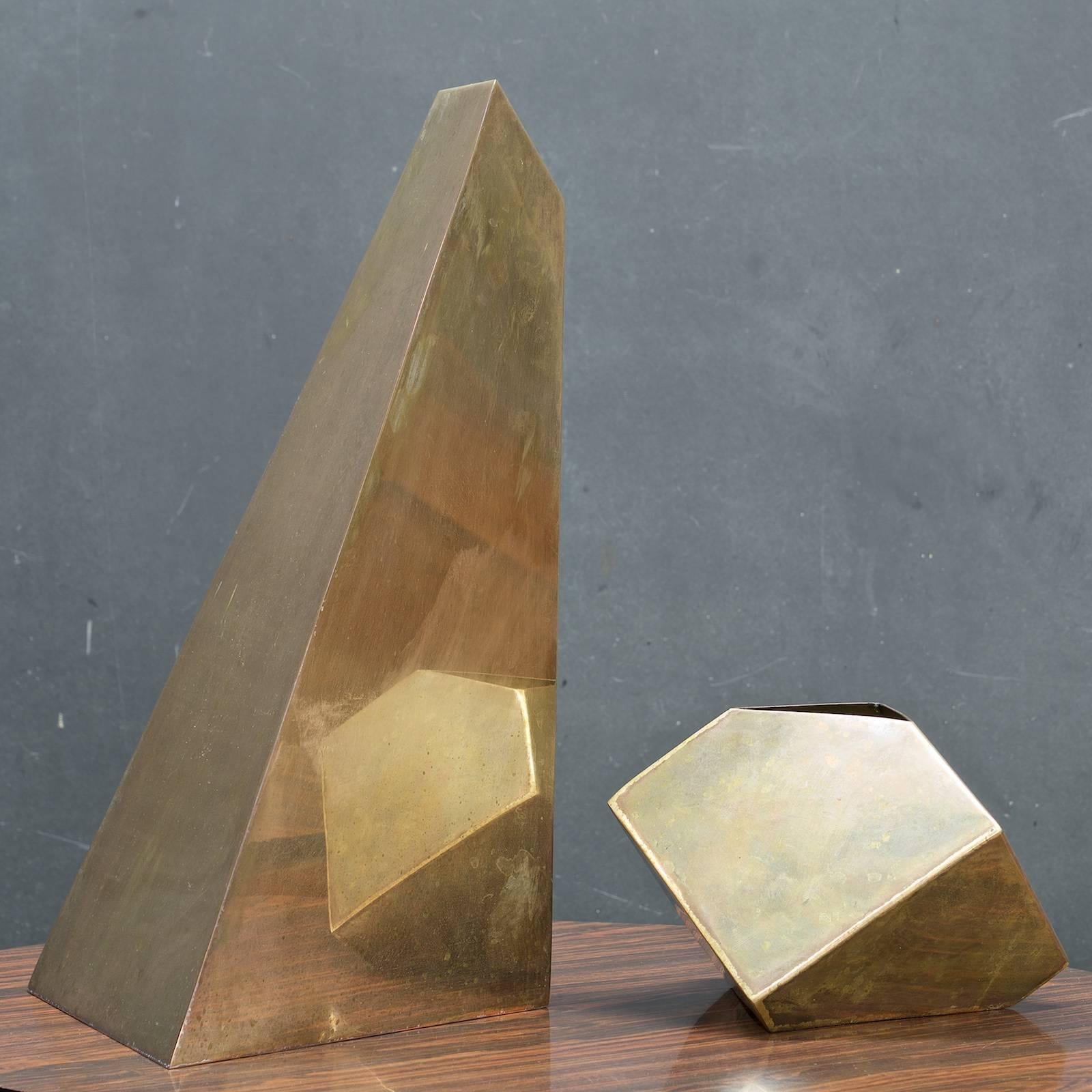 Late Mid-Century tarnished brass geometric polygon decorative obelisk flower vase forms.
Small W 8 x D 7 x H 5.5 in.
Large W 9.25 x D 8.5 x H 16 in.