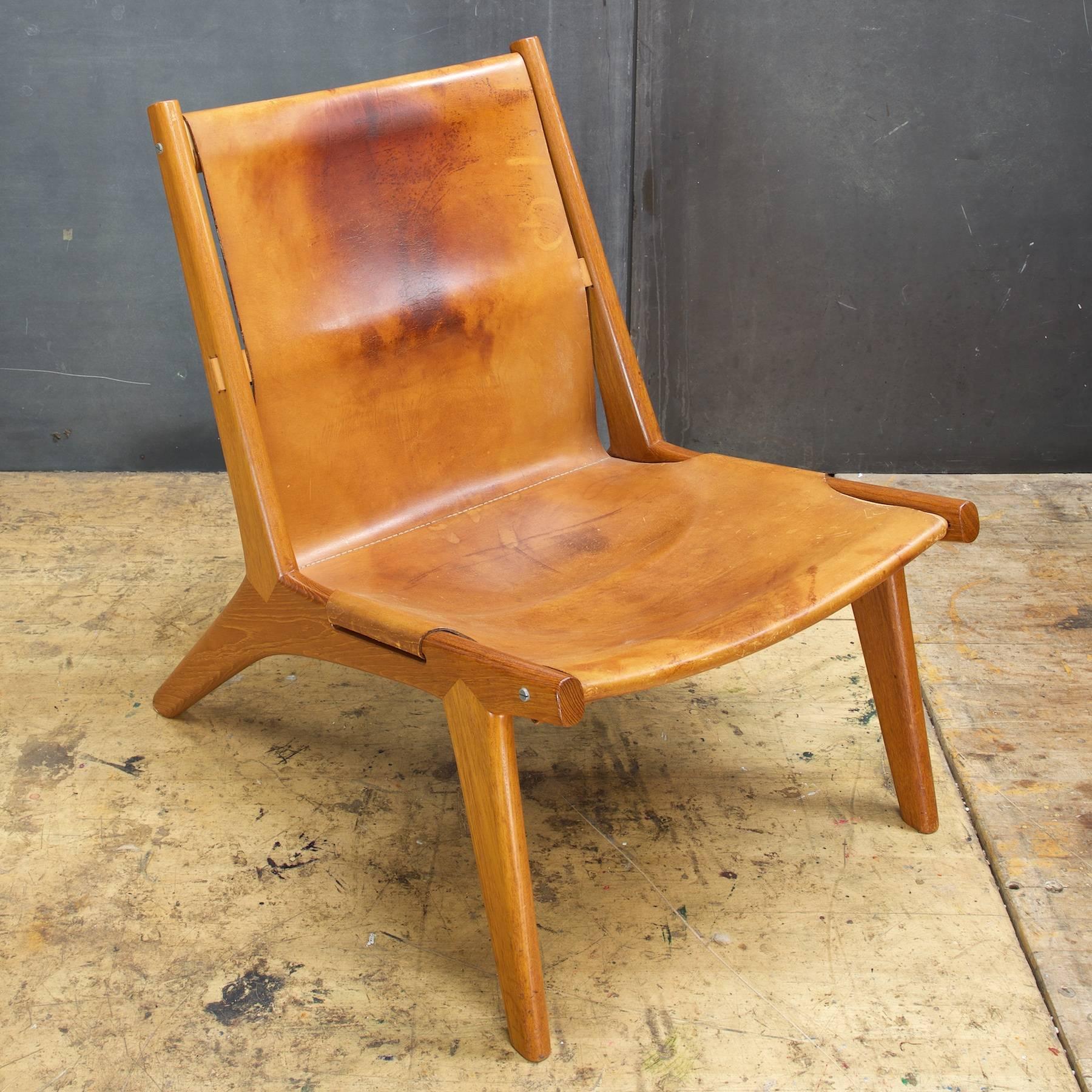 Exceedingly rare hunting chair is perfectly aged original leather sling.