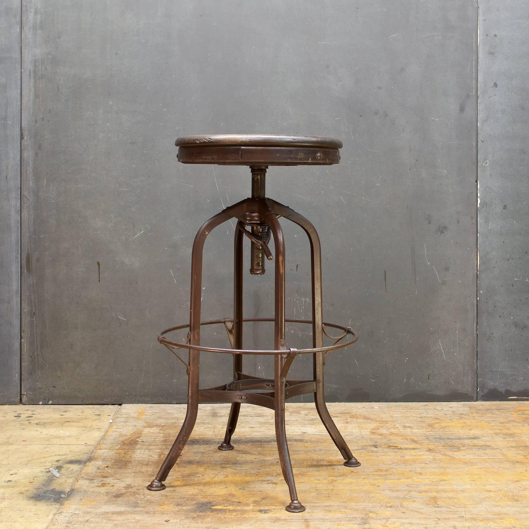 Original and complete. Patina and wear to wooden seat.

Measures: W 18.25 x D 18.25 x H 28.5 to H 33 in. (Seat dia: 15 in).