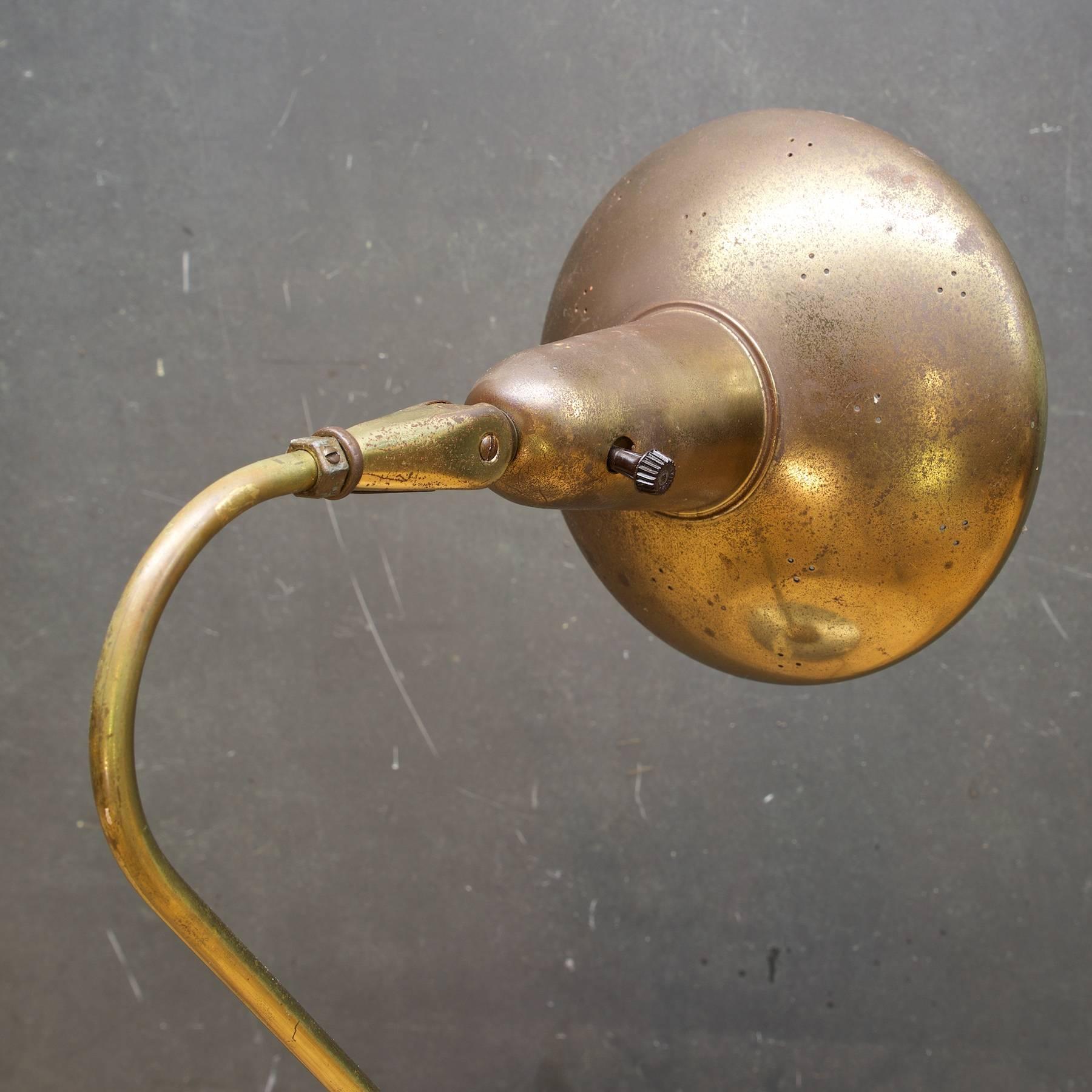 Lightolier lamp with an iconic 1950s Mid-Century pinholed brass head/shade.