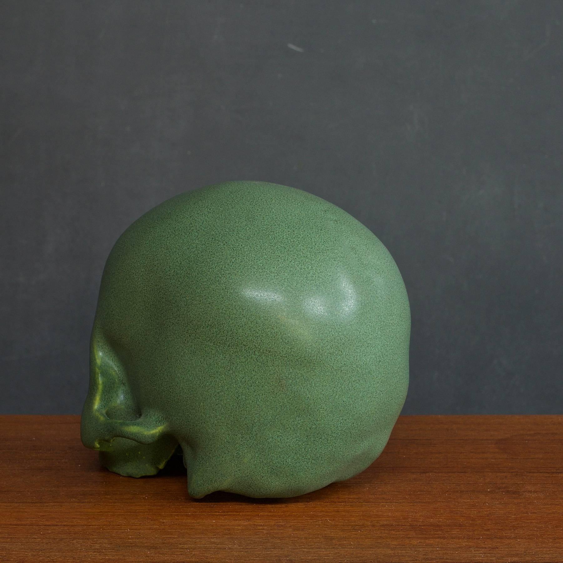 Arts and Crafts anatomic style glazed pottery skull sculpture bookend. Contemporary Reproduction.