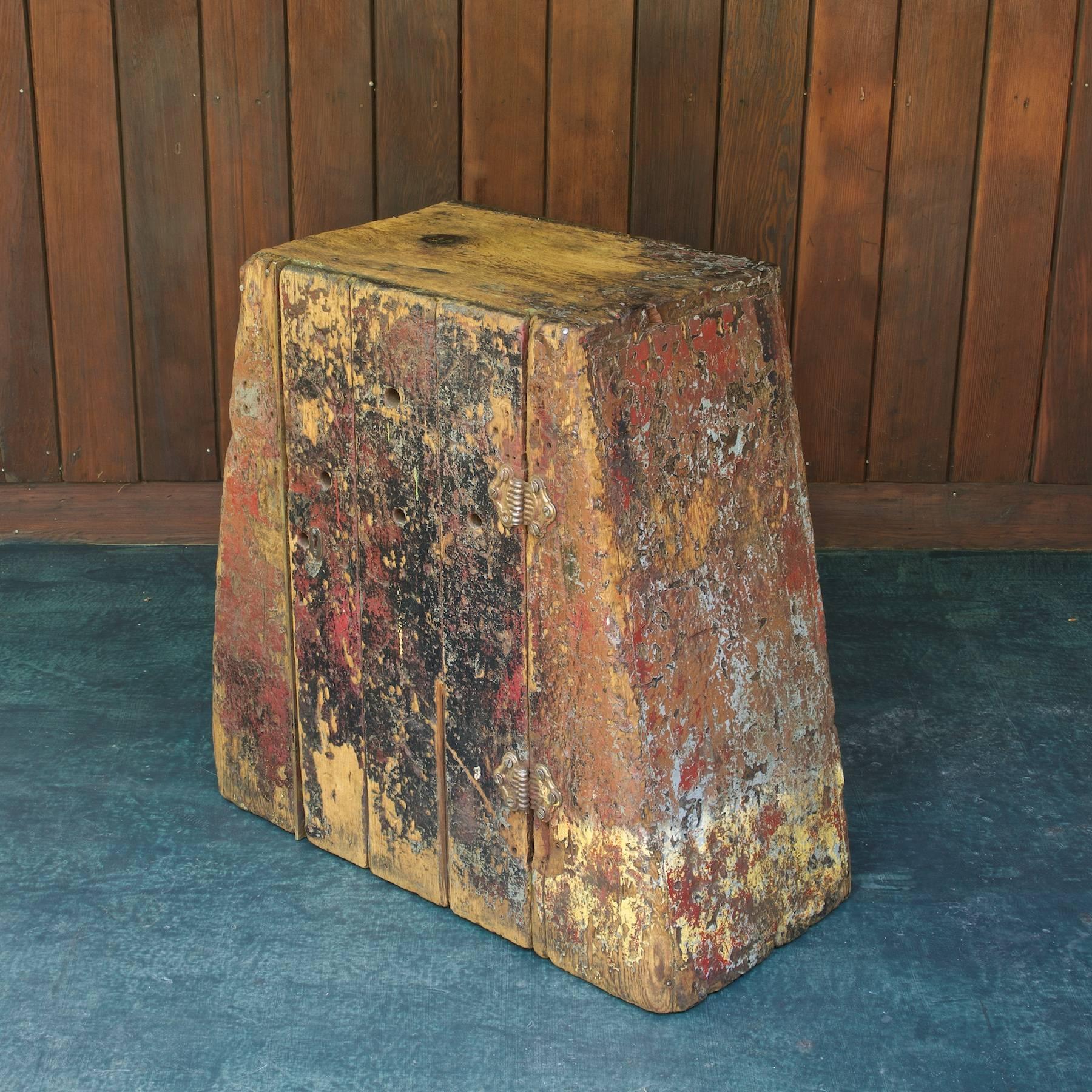Heavily worn patina to old growth pinewood. Triangular shape, two interior shelves. Strong, sturdy, fully functional cabinet/cubby. Many original square nails visible, as well as others.

Top W: 20.5 / Bottom W: 31 x D: 14 x H: 29.5 in.
 