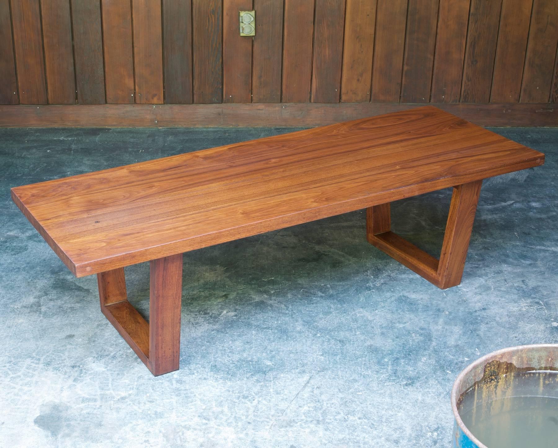 Very heavy, constructed of solid walnut. Original finish, so you see some wear from normal uses. Some splitting to top surface boards, some spalting (spotting) on the legs, and checking on the ends of the planks. This is all standard with very old