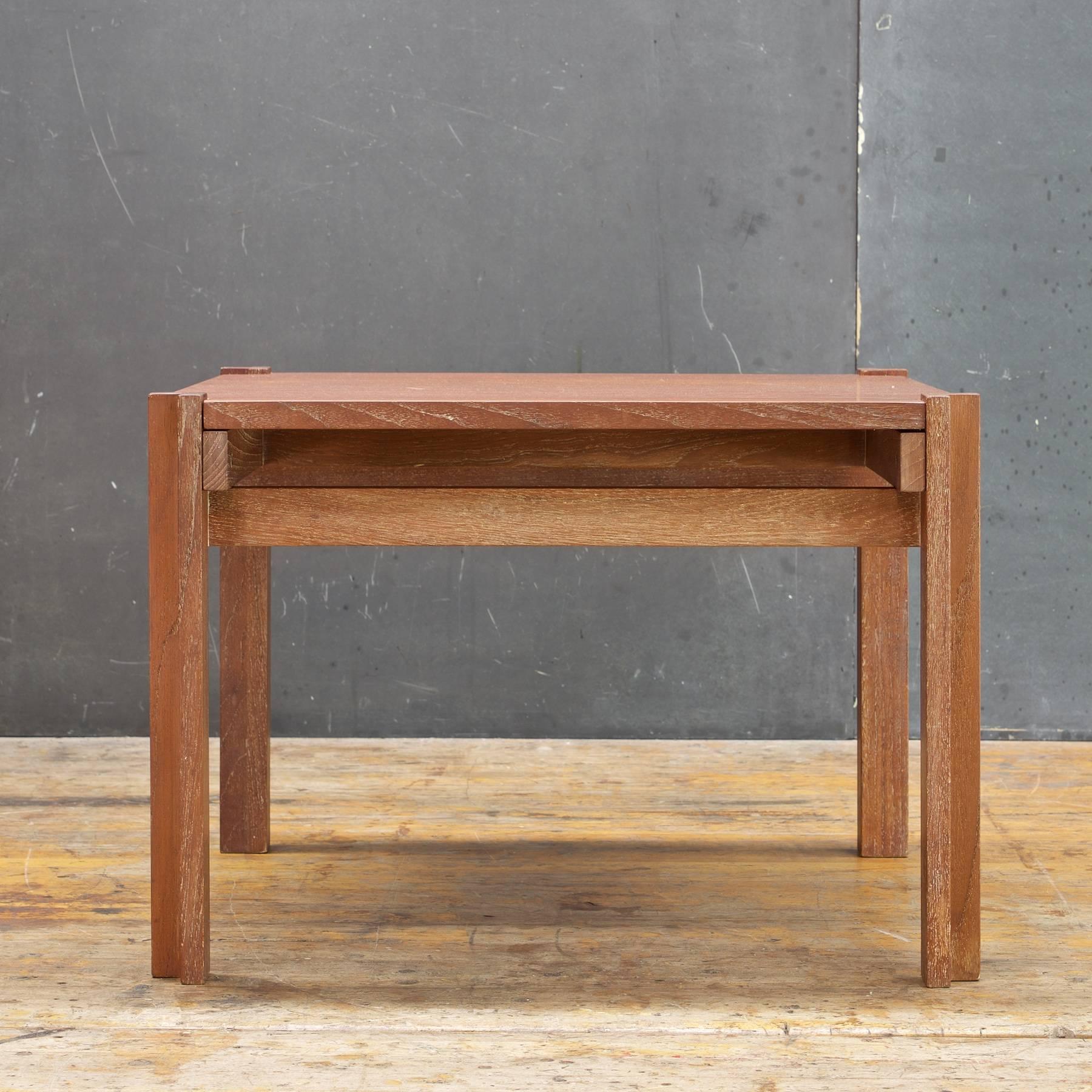 Attributed to Werner Blaser for Wells Furniture Mfg. of Chicago. Rare vintage Mid-Century teak geometric bauhaus styled occasional table distributed by John Stuart with metal medallion on frame. 

Table surface is a flip top, bottom surface