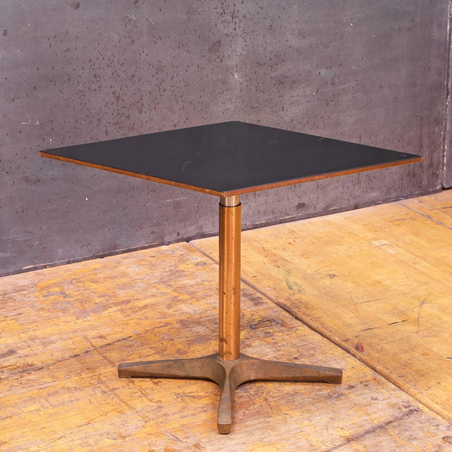 Adjustable Height, 19 to 28 in.

Wonderful vintage Mercantile department store Art Deco diamond pedestal, bronze-toned base with thick black micarta quartzite or bakelite polished veneered surface. Very heavy, sturdy and highly adjustable height.