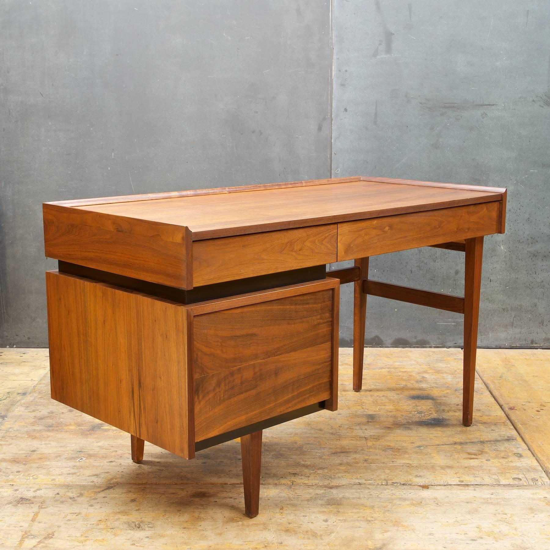 Rare and made in the USA, Classic American Modern oiled walnut desk designed by Milo Baughman for Dillingham. Beautiful grained oiled walnut finish, superior quality. Features two drawers over generous size file drawer. Finished walnut on all sides,