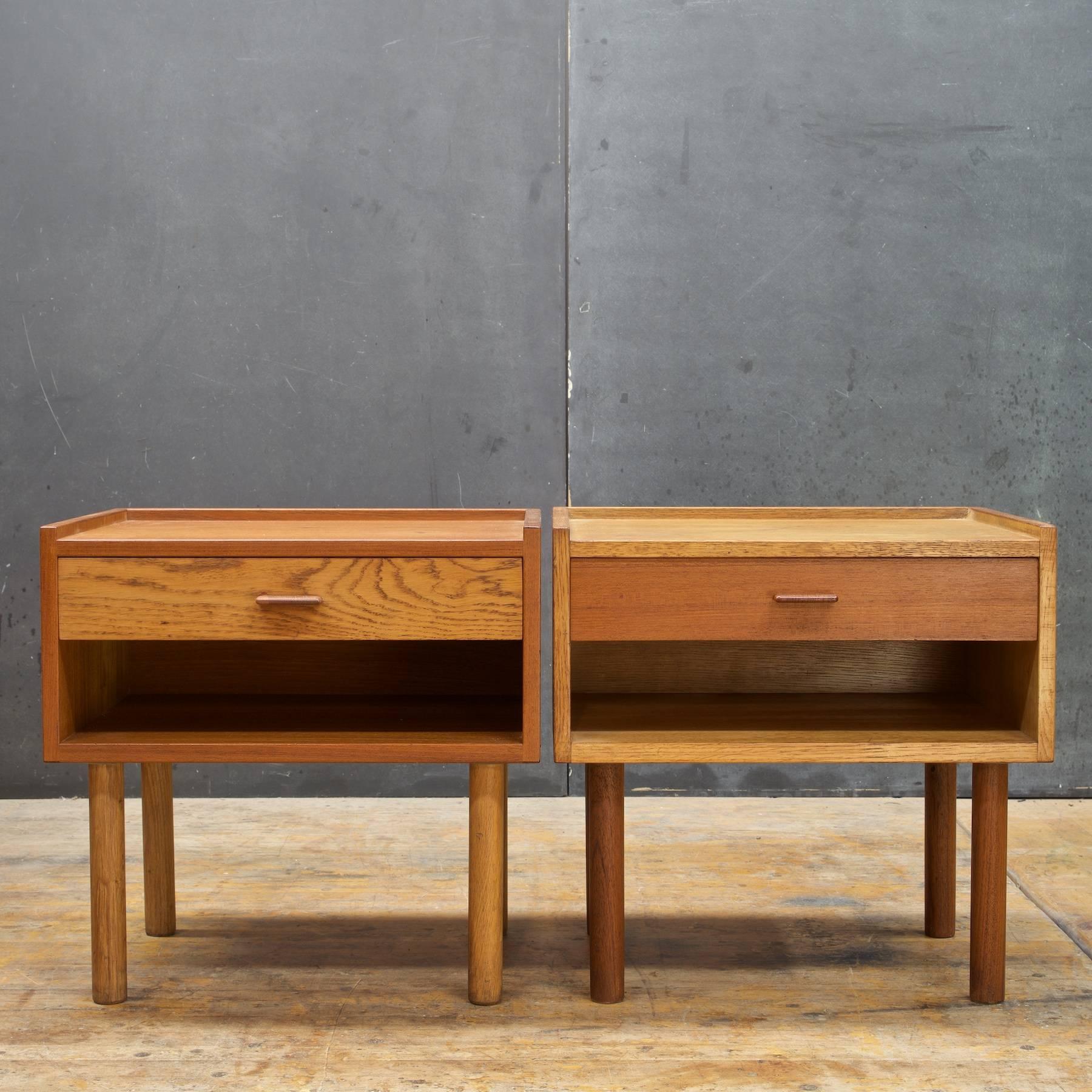 Wonderful pair of teak and oak bedside table with cubby and single drawer designed by Hans J. Wegner for Ry Mobler, Denmark. Cubby height is 3.85 inches.