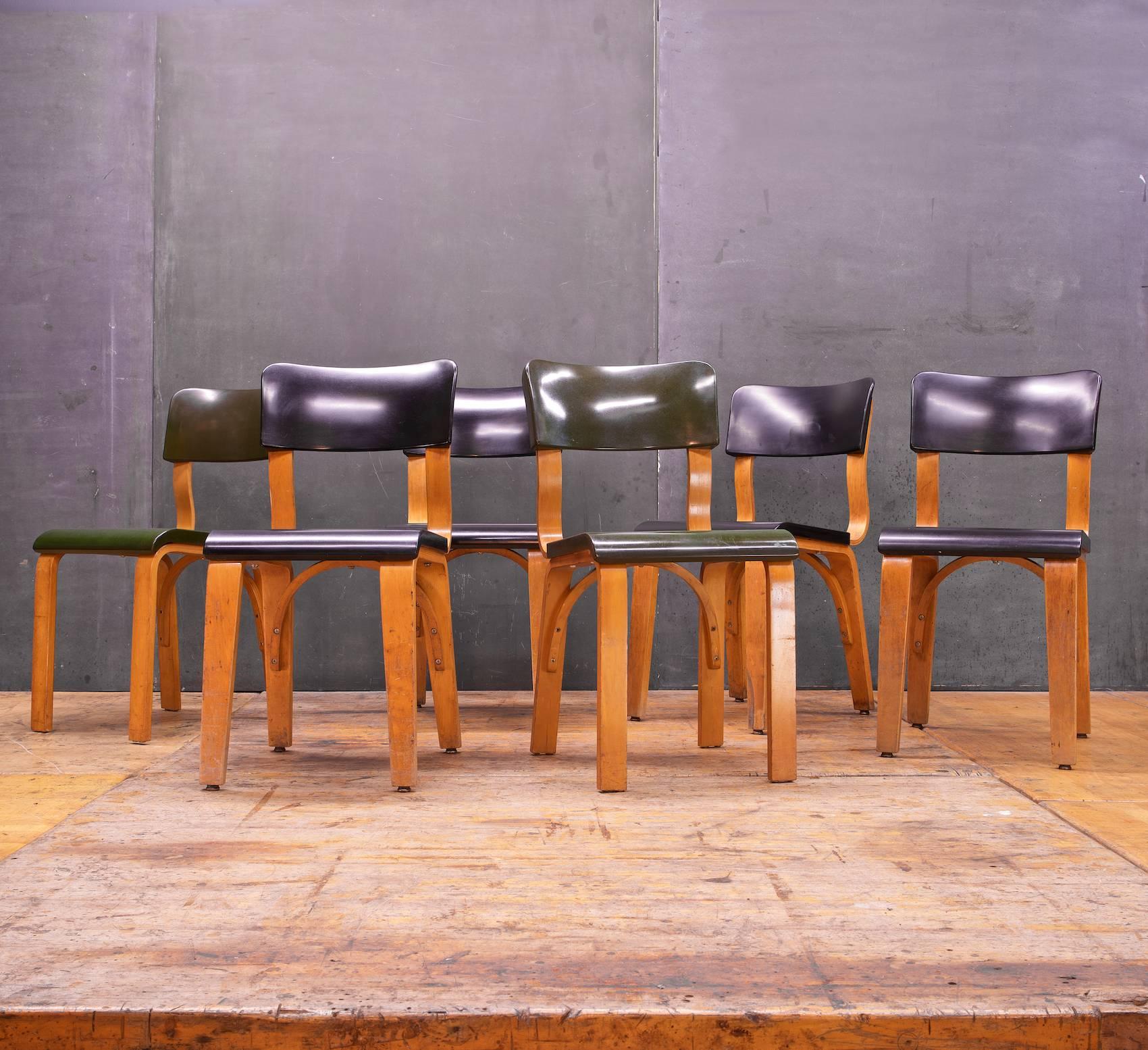 Early Mid-Century Modern Design in Original Finish; Patinated Lacquered Birch Frames.  Black Chair Legs are Taper, and Greens are Straight.