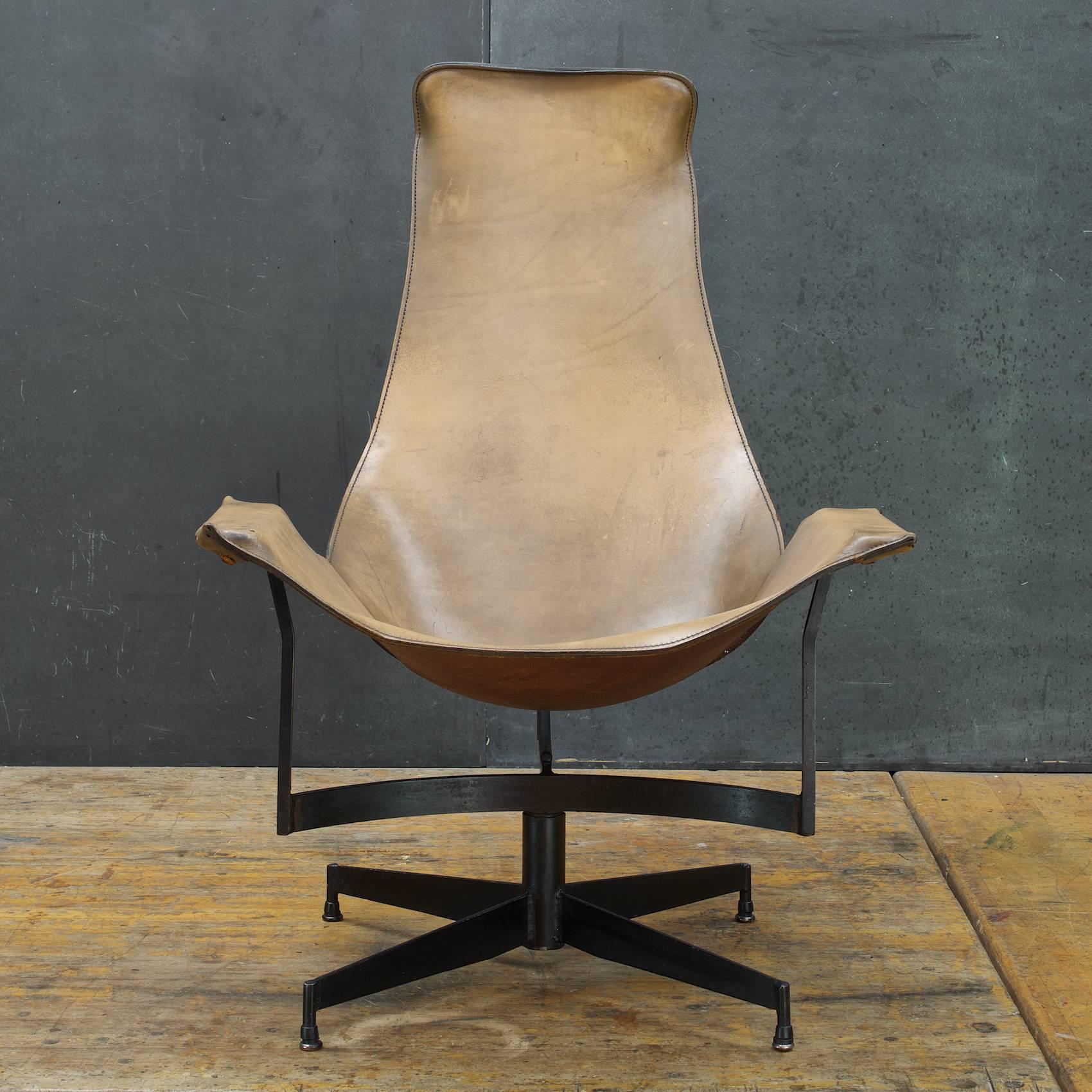 Attributed to Katavolos, A swivel leather sling lounge chair. Nice patina, heavily worn leather but useable and strong, no rips, no tears.