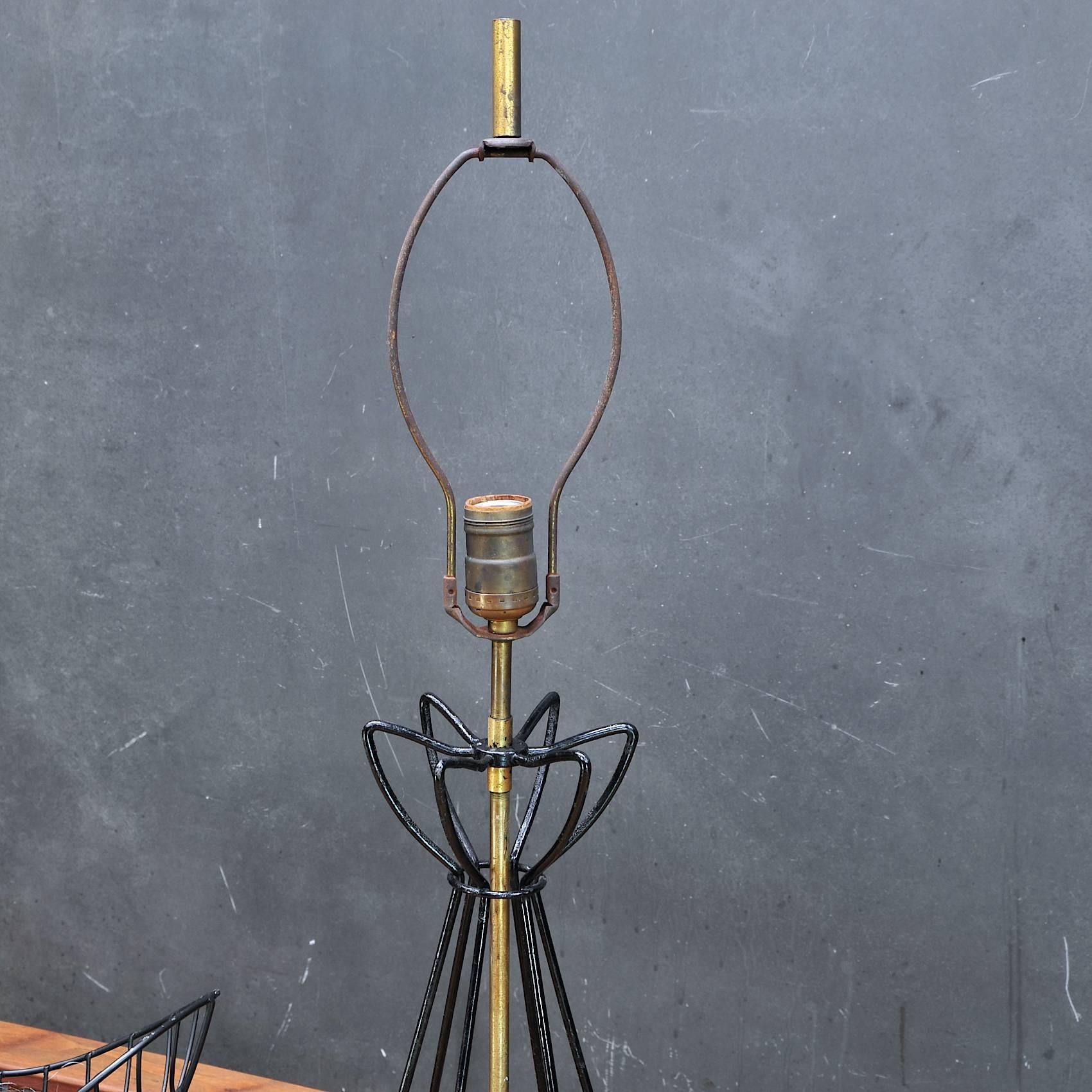 Andree Ferris & Reta Shacknove, most celebrated Mid-Century female Industrial Design team. A structural bent wire and brass table lamp. Original Fairies socketry and two stage switch marked with F. original finial. No shade.