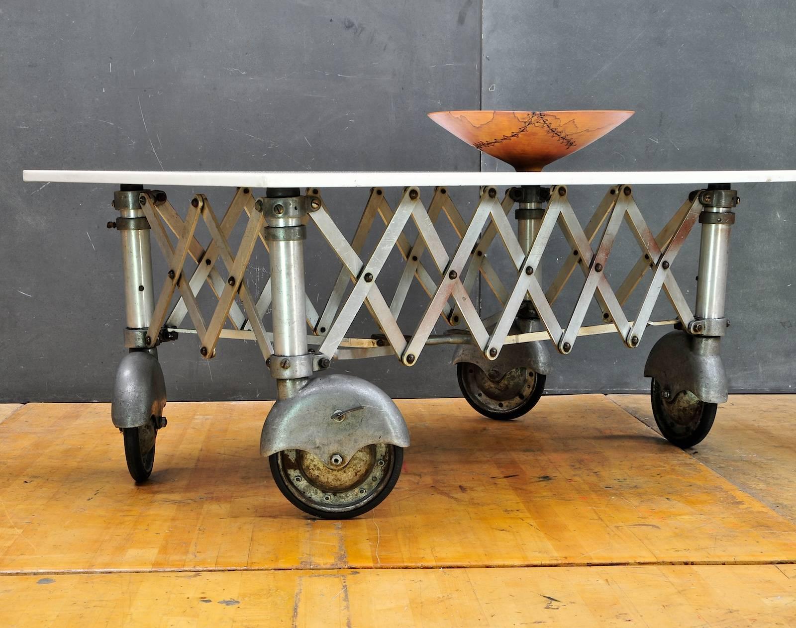 Assembled as coffee table. Measures: W 48 x D 30 x H 20.75 in.

Vitrolite slab, USA, circa 1910s.
Machine Age coffin trolley, USA, circa 1940s.
