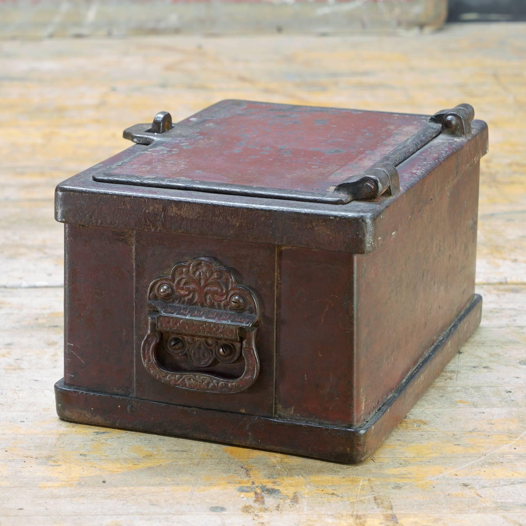 Old heavy iron lockable lidded box. Eastlake style handle castings.
