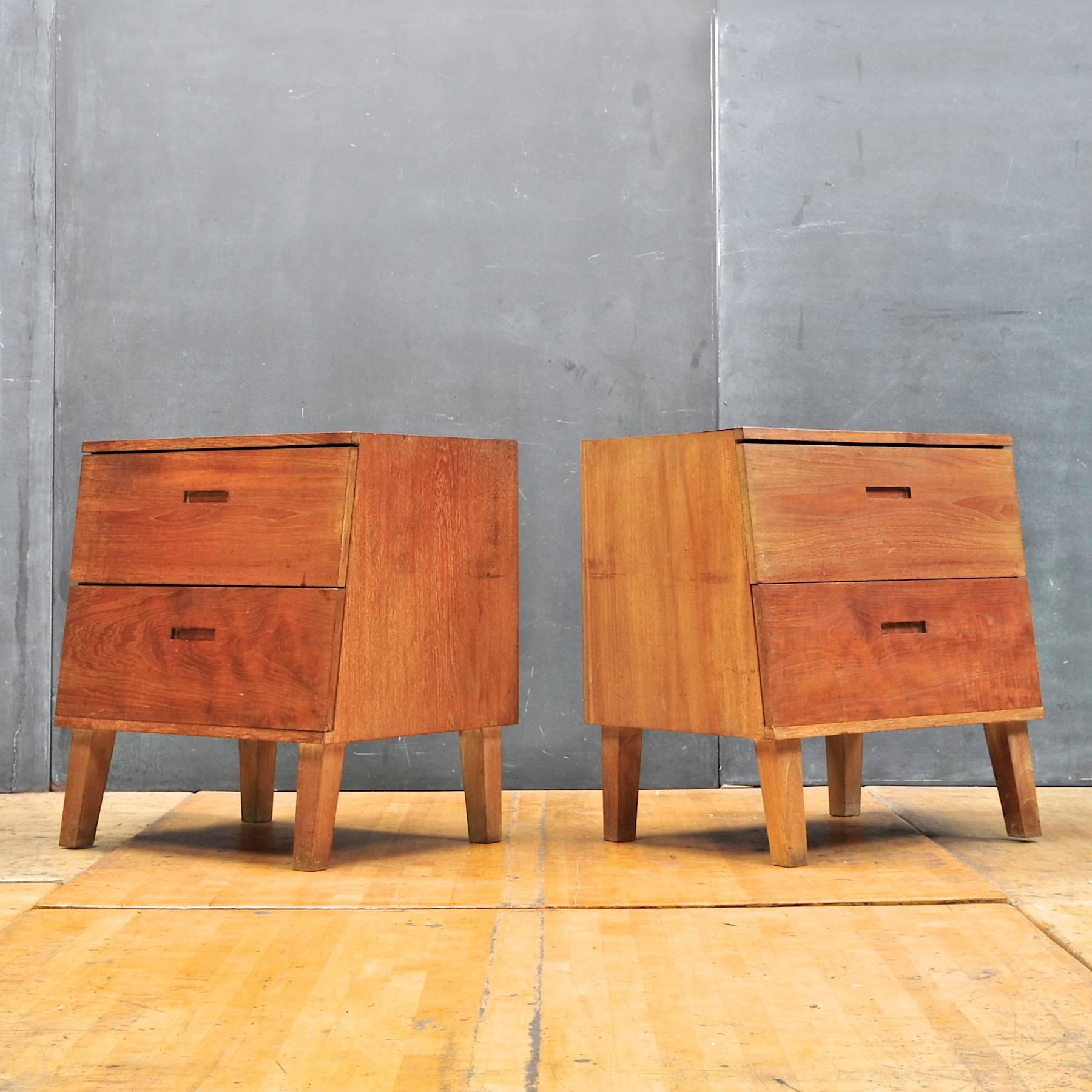 Unknown craftsman made slant faced modernist bedside chests. Solid very old growth hardwood Construction, Inset pulls, tapering legs. Oiled finish. 

In the style of George Nakashima, and other woodworkers of the Mid-Century Era.

Measures: W 24 x D