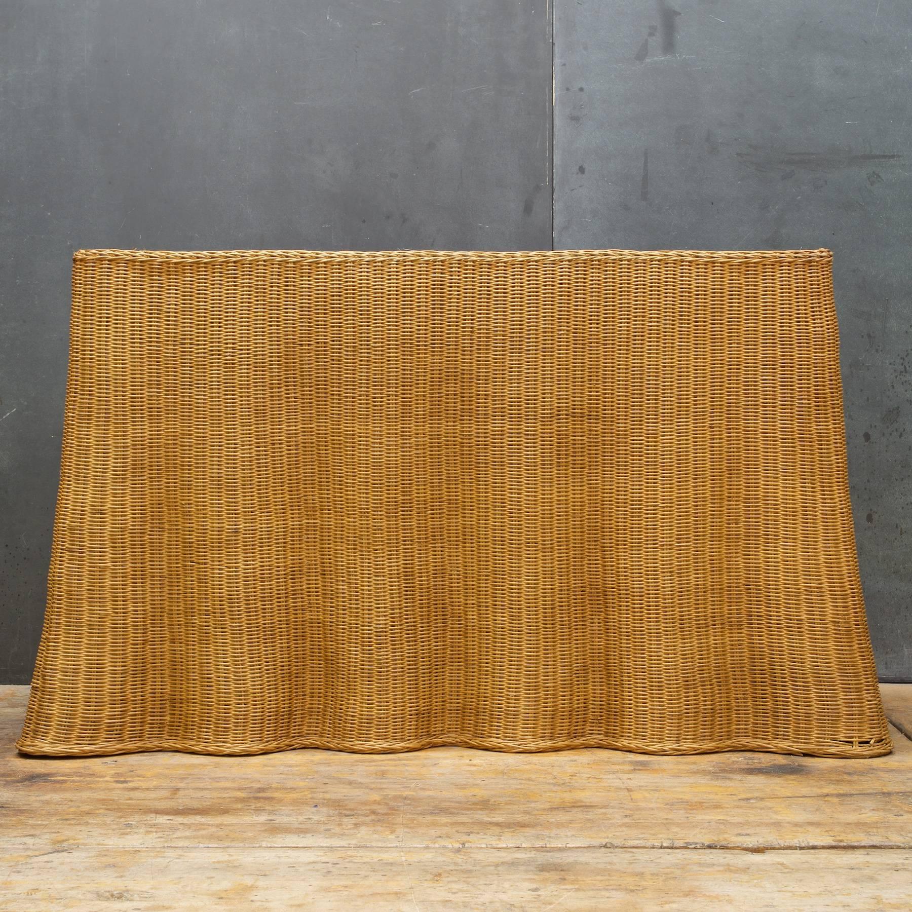 1970s sculptural handcrafted Trompe L'oeil rattan draped sheet (ghost) console table. Wicker in a wonderful draped form, amazing and quite rare. Fairly large in size, excellent for behind the sofa.

Measure: W 53 × D 19 × H 30 in. (Top W 45.5 x D