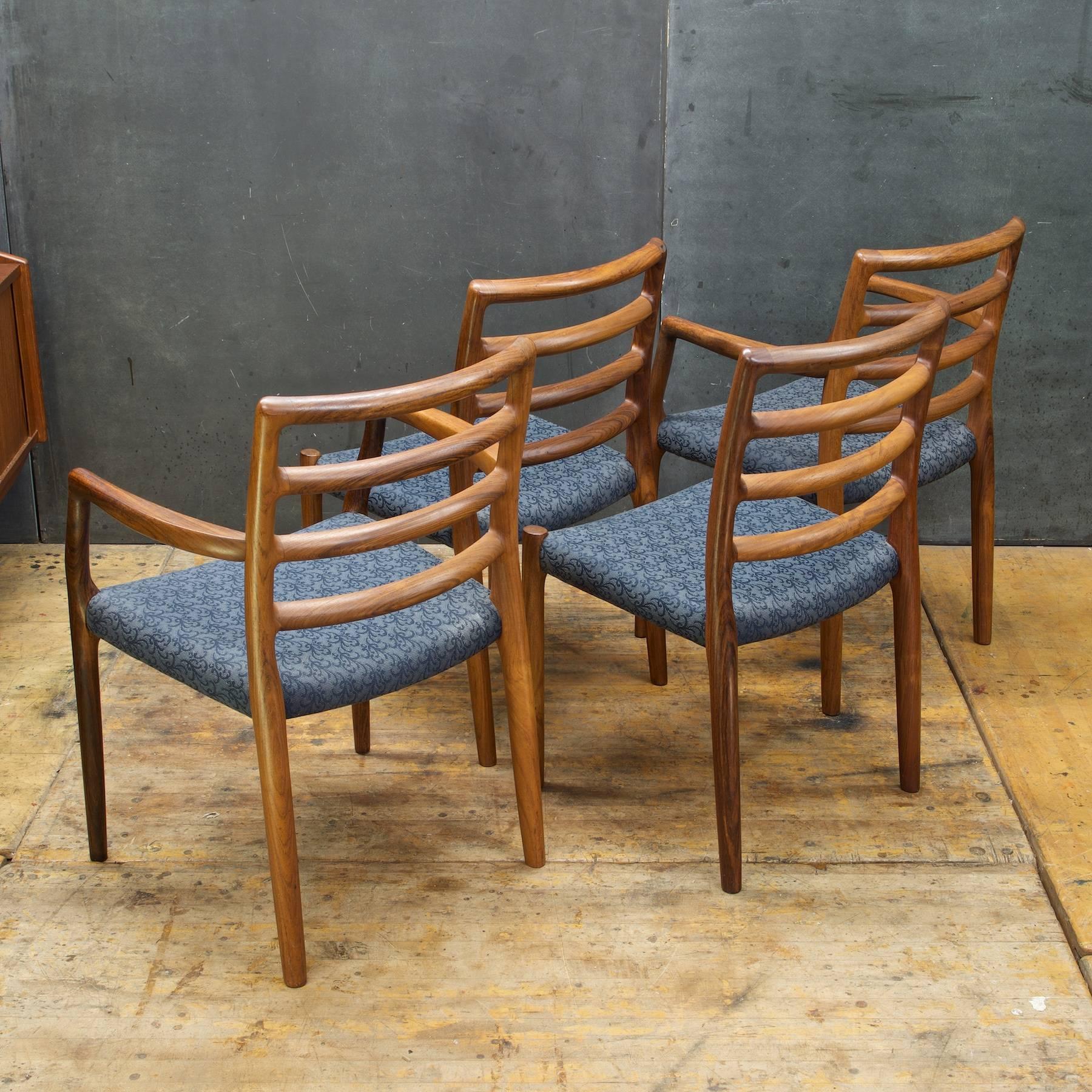 Wonder rare wood dining set of four chairs; two side chairs and two armchairs in original 1970s fabric. No tears but could use a good cleaning. All chair frames are tight and strong.