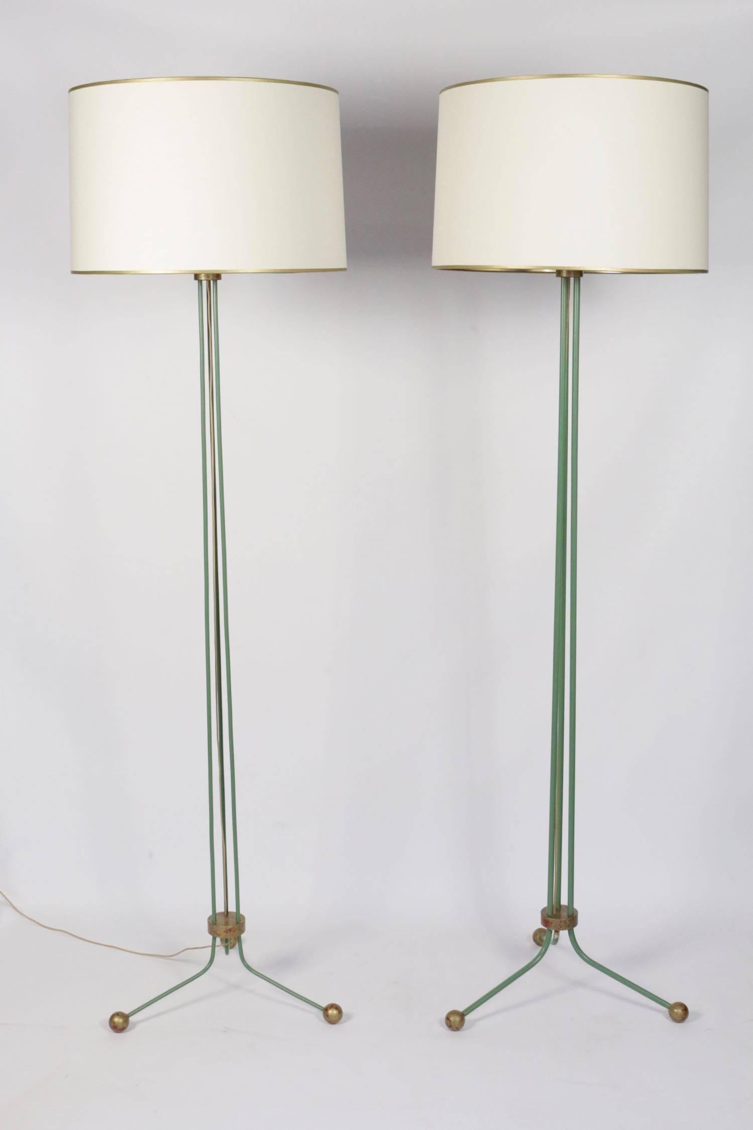 
Set of two elegant lamp floor 1940, attributed to Jean Royére's creations. 
Tripod base mounted on three gilded balls. The lampfloor structure consists of three metal stems lacquered verdigris granted to the original lacquer. 
Lampshades