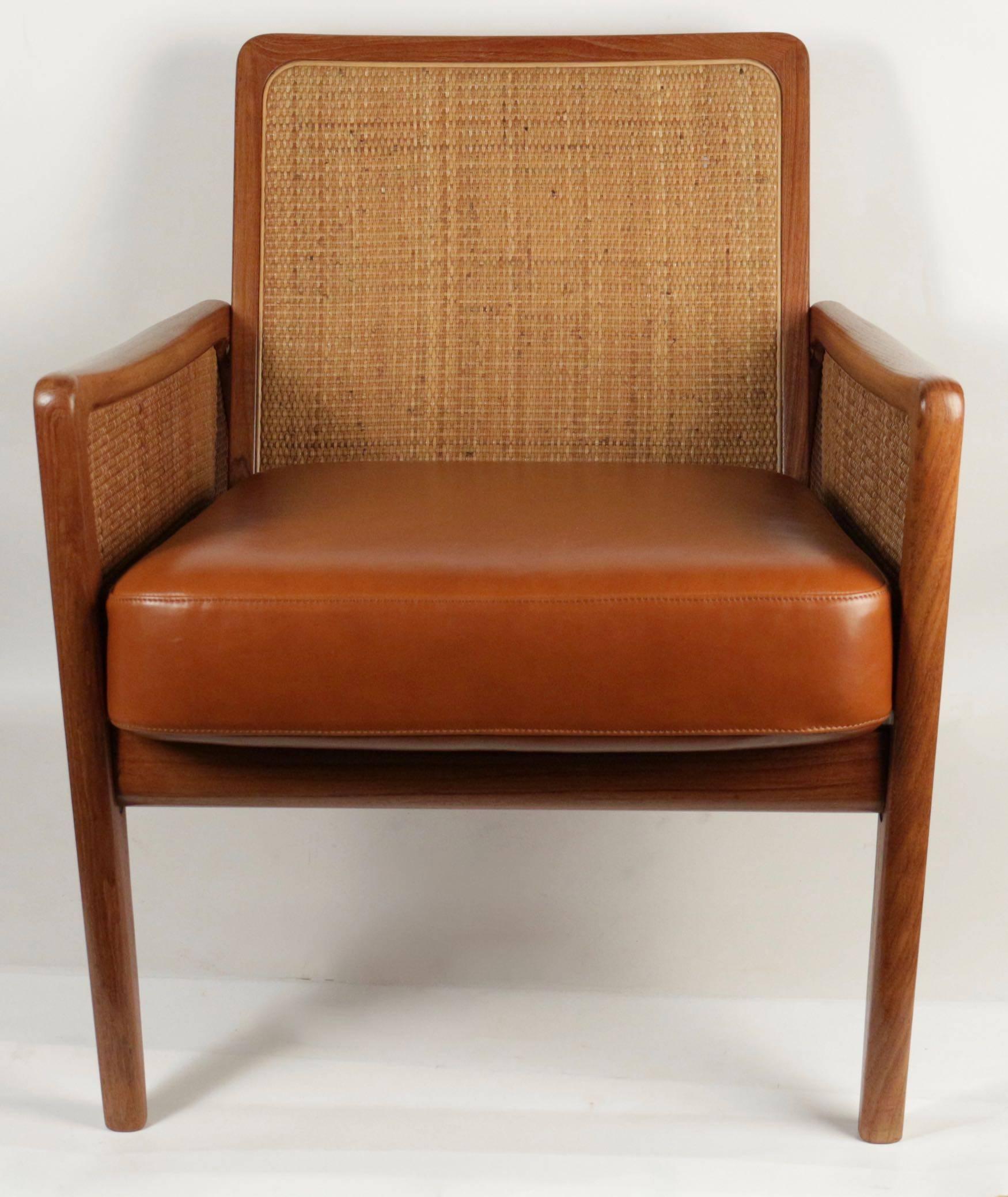 Pair of armchairs by Peter Hvidt & Olga Molgaard, model FD151, 1956.
Teak and original canning. Manufacturer France & Daverkosen.
Upholstery have been remade in Caramel full grain leather.

Rare and beautiful armchairs.
