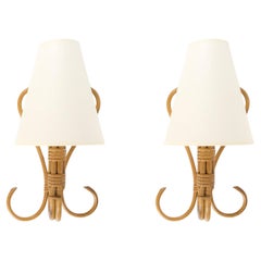 1950 Pair of rattan wall lamps by Louis Sognot
