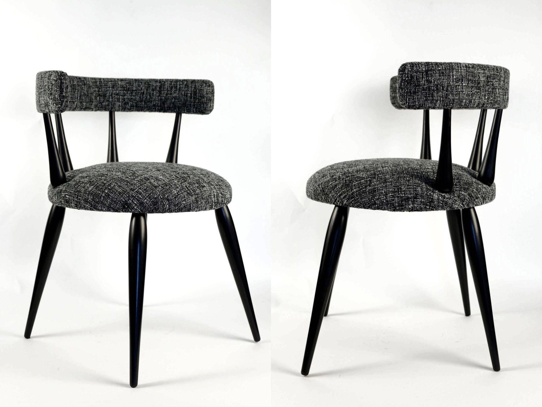 Pair of armchairs in a taste of Ilmari Tapiovaara, 1950.

Charming pair of small round armchair with four slender legs, black laquered. Spindle back. Upholstery has been remade with an fabric of wool black and white.
 