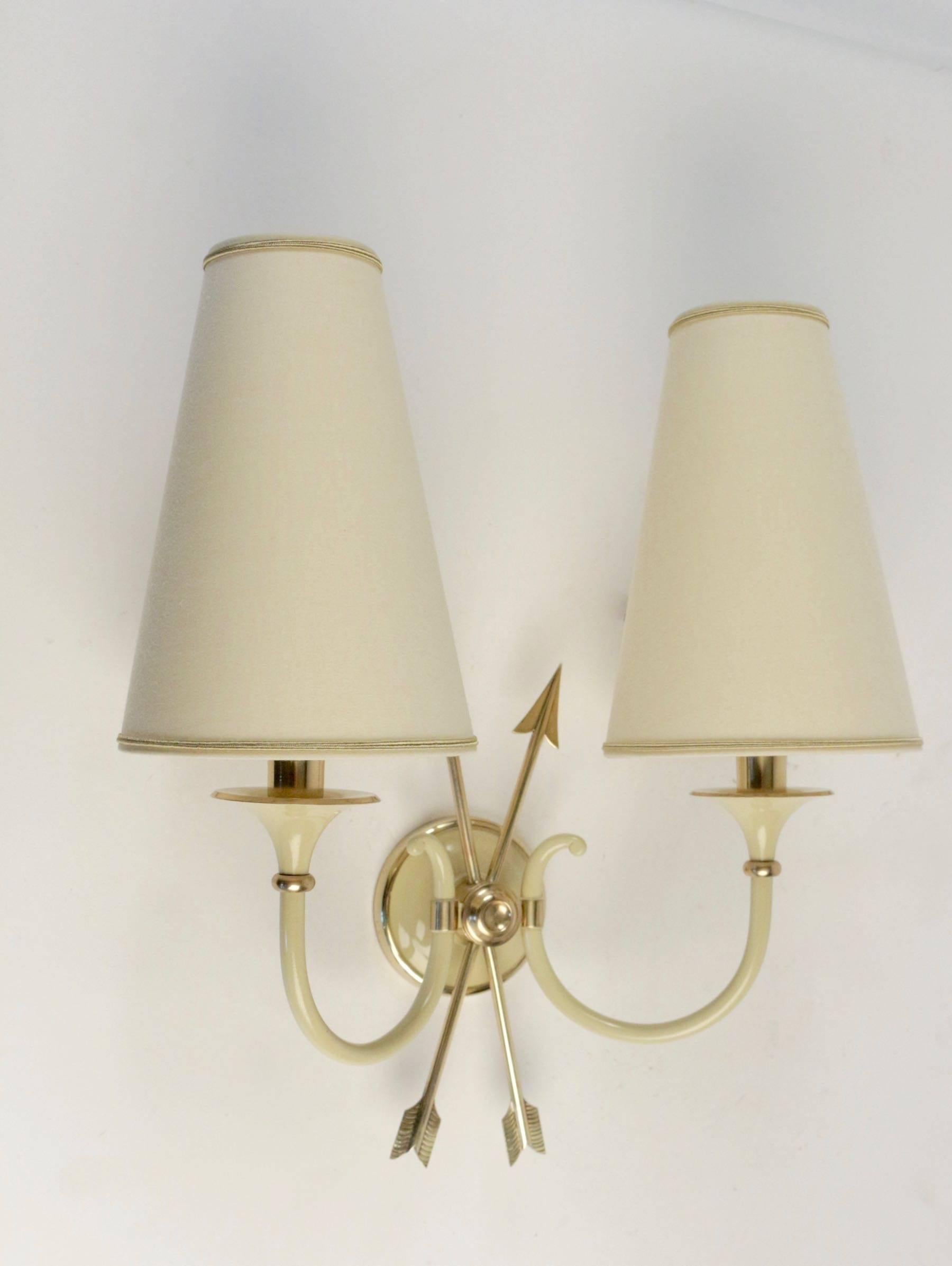 Brass Pair of Neoclassical Sconces with Two Crossed Arrows by Maison Lunel, 1950